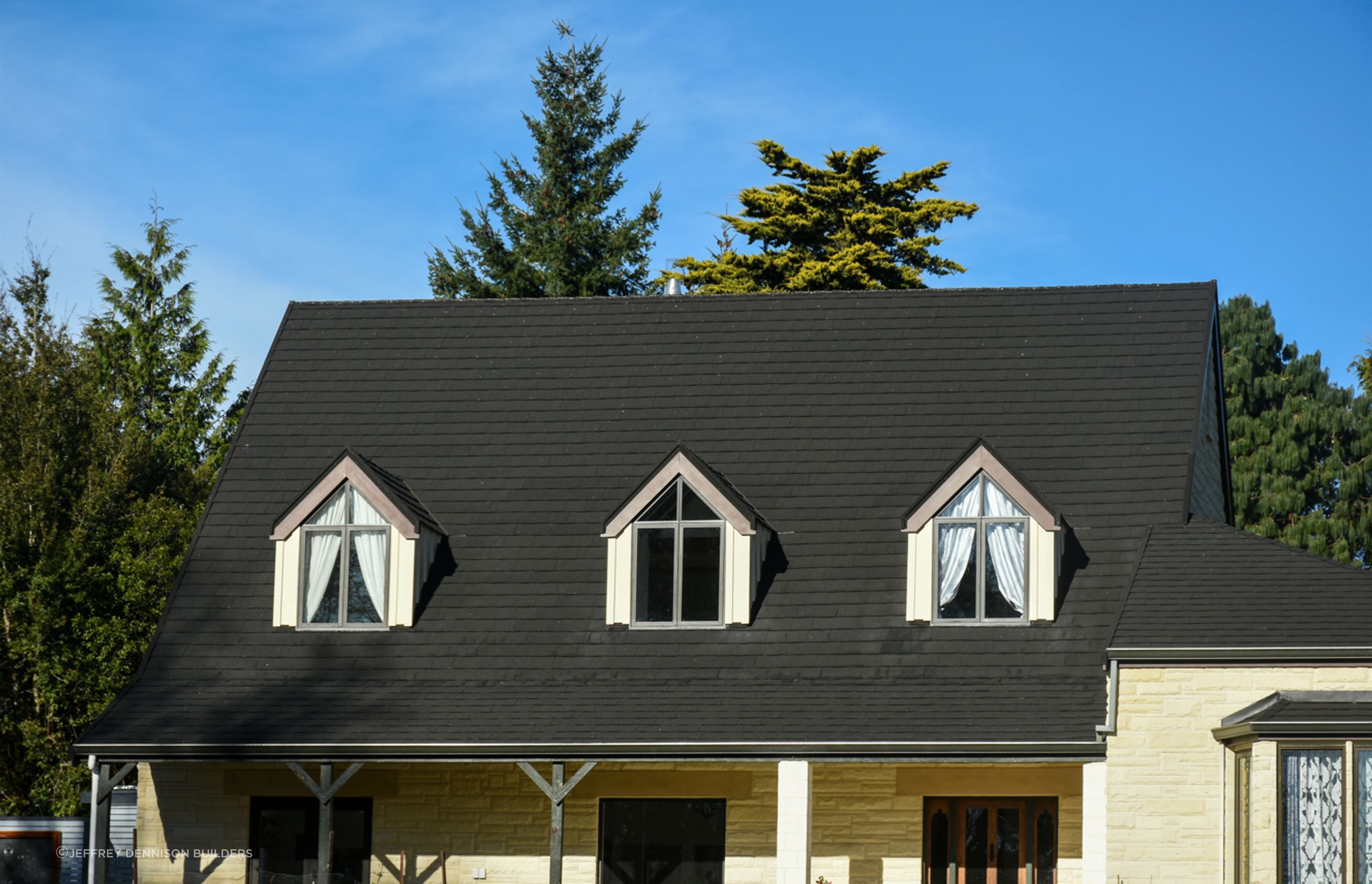 Close up - Front view - new roofing with slate alternative, double-glazed windows, bargeboards over dormer windows, restoration/cleaning of Oamaru stone along with porcelain tiles by the front door entrance