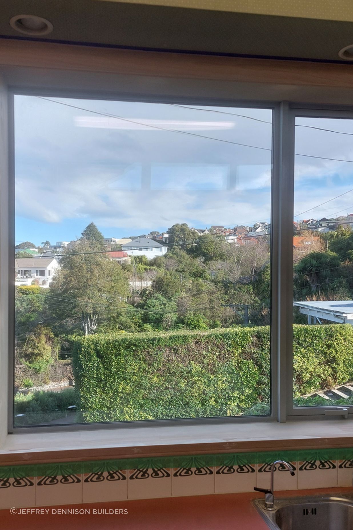 6-19-Tweed-St-Roslyn-Dunedin-Newly-installed-double-glazed-window-in-the-kitchen-being-masked-ready-for-painting-JDBuilders.jpg