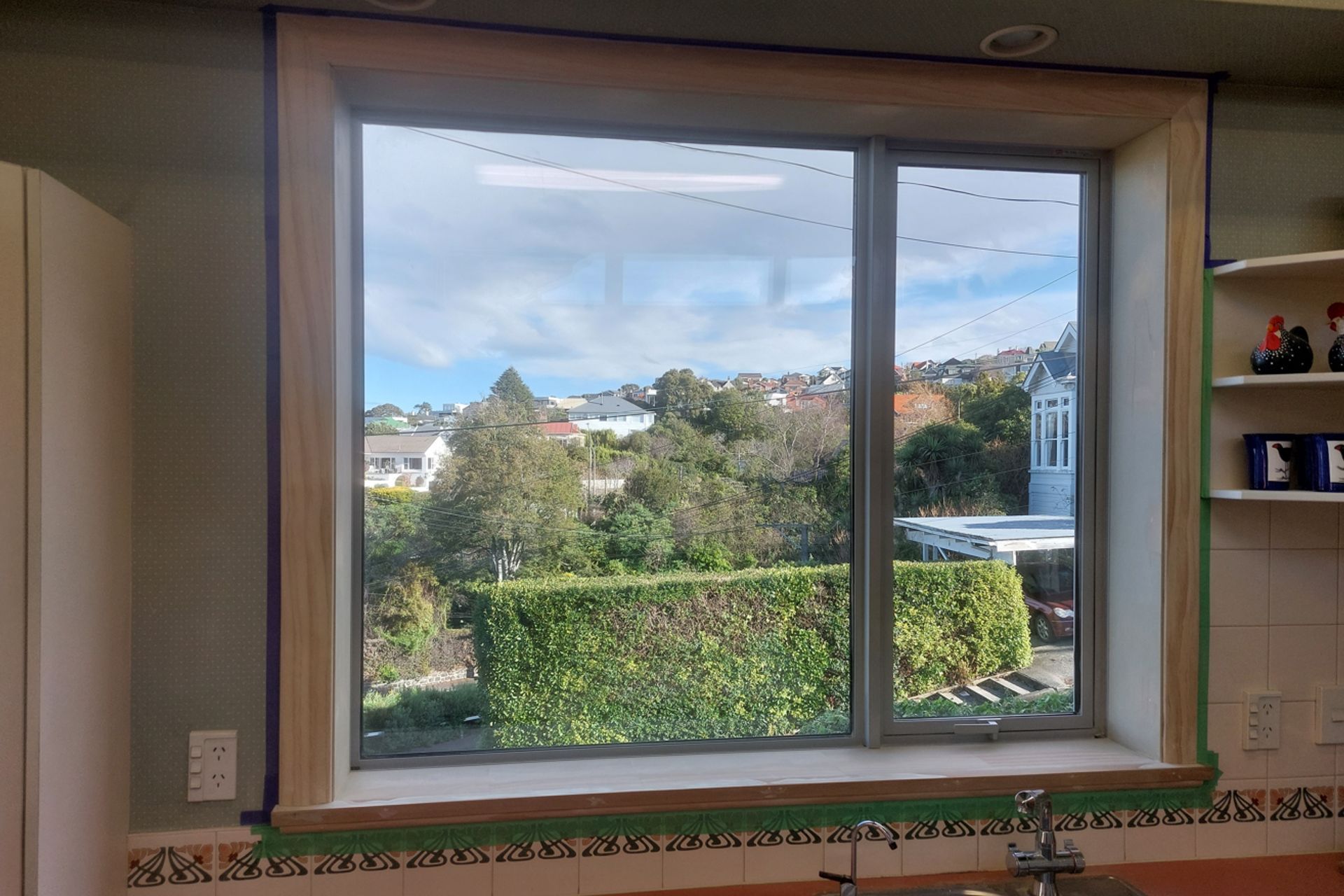 6-19-Tweed-St-Roslyn-Dunedin-Newly-installed-double-glazed-window-in-the-kitchen-being-masked-ready-for-painting-JDBuilders.jpg