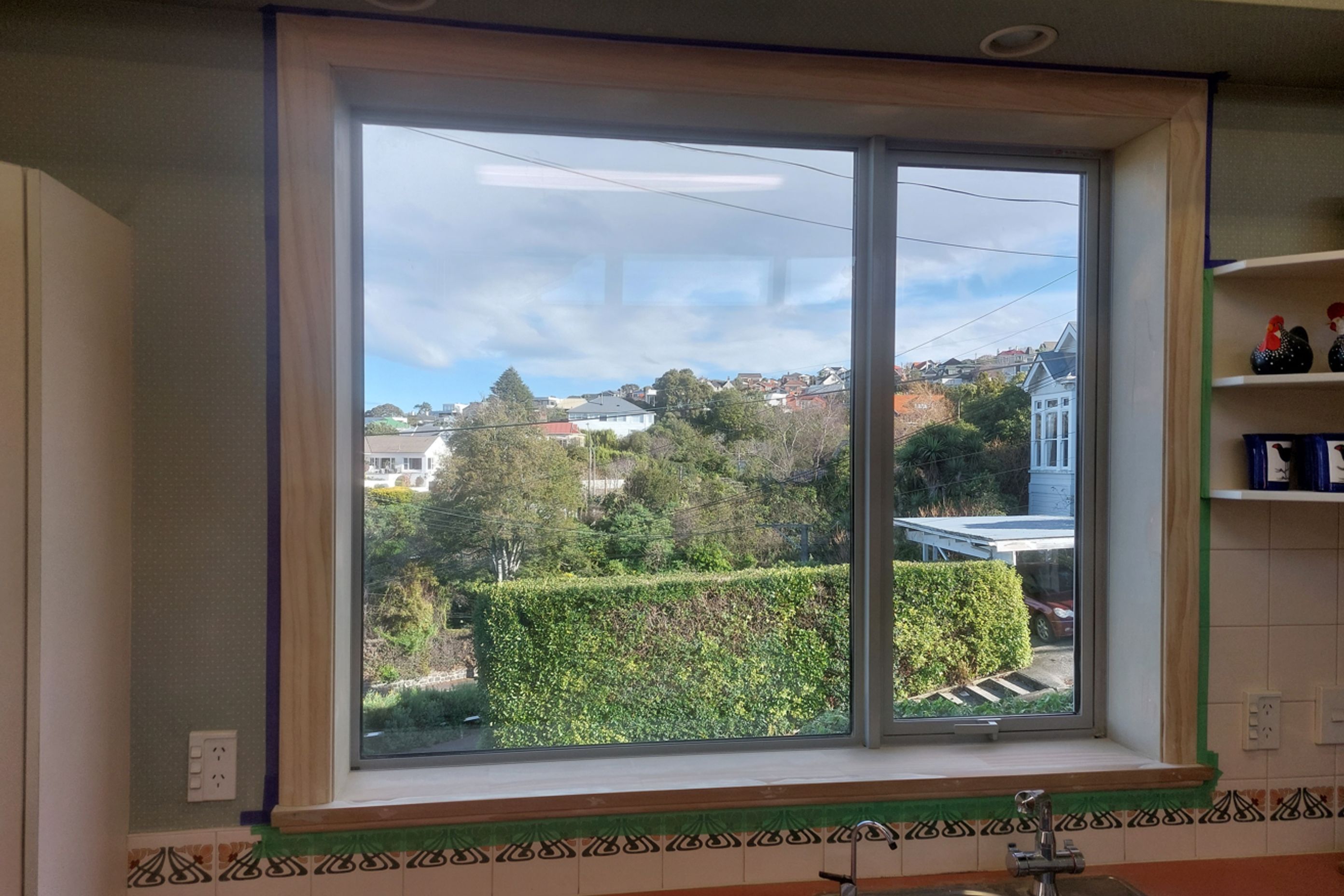 6-19-Tweed-St-Roslyn-Dunedin-Newly-installed-double-glazed-window-in-the-kitchen-being-masked-ready-for-painting-JDBuilders.jpg