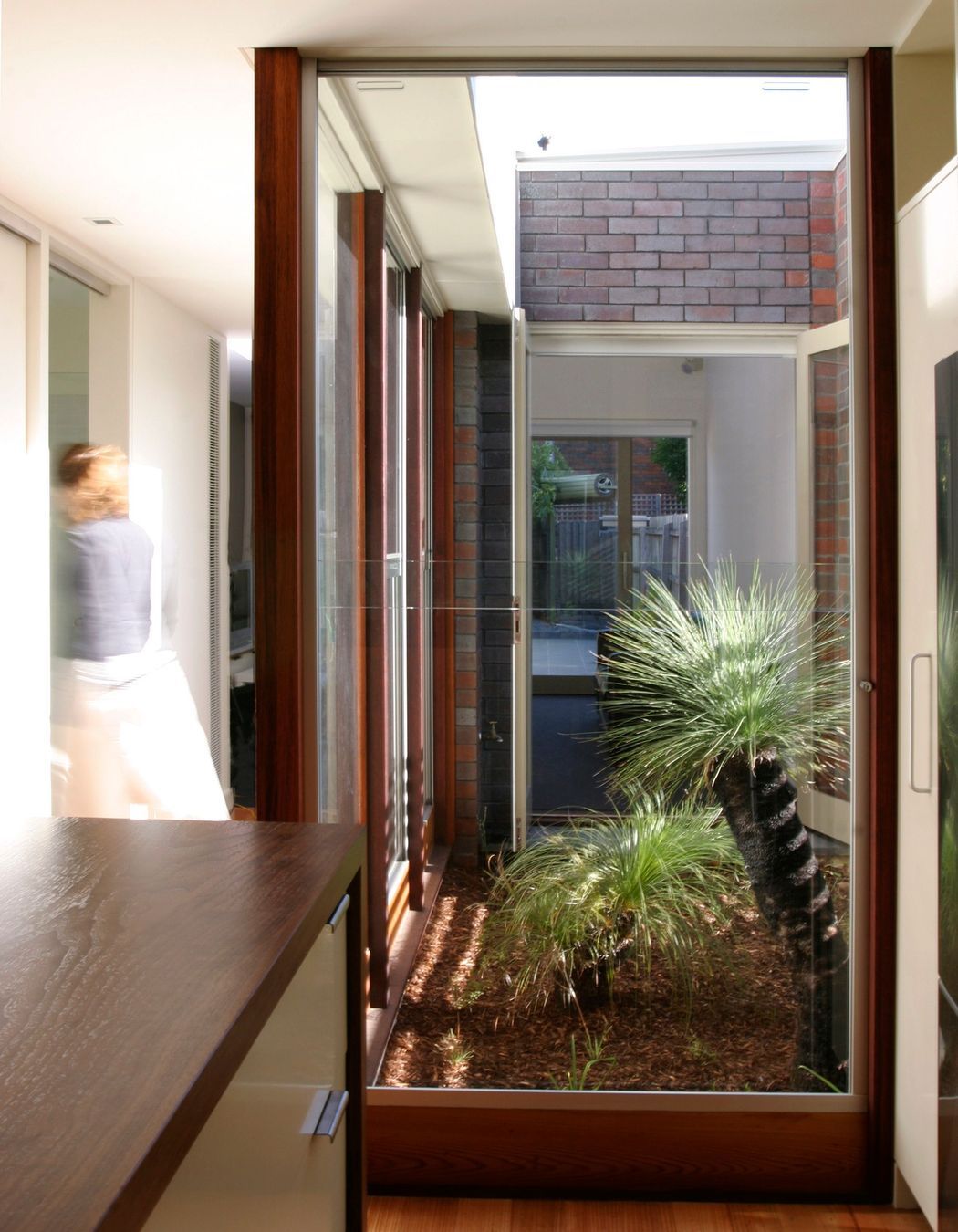 An internal courtyard floods the interior space with light