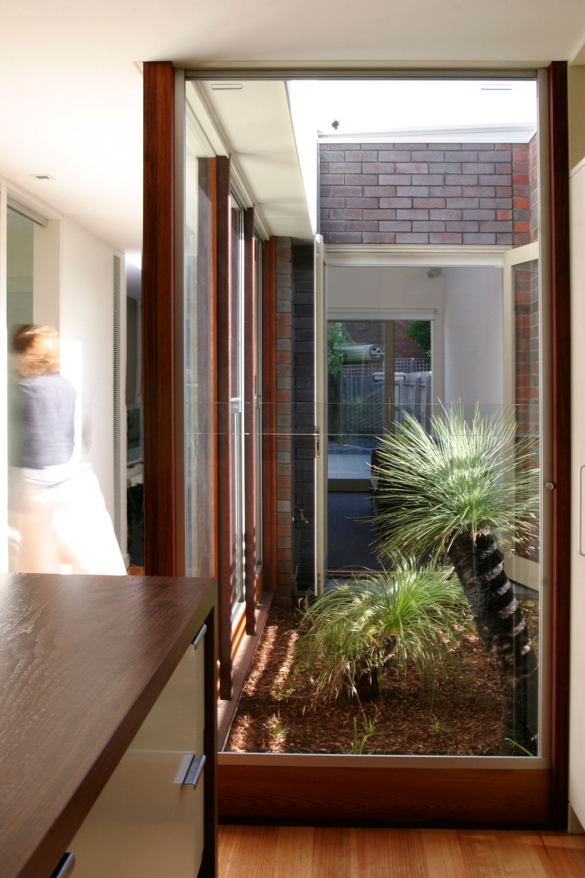 An internal courtyard floods the interior space with light