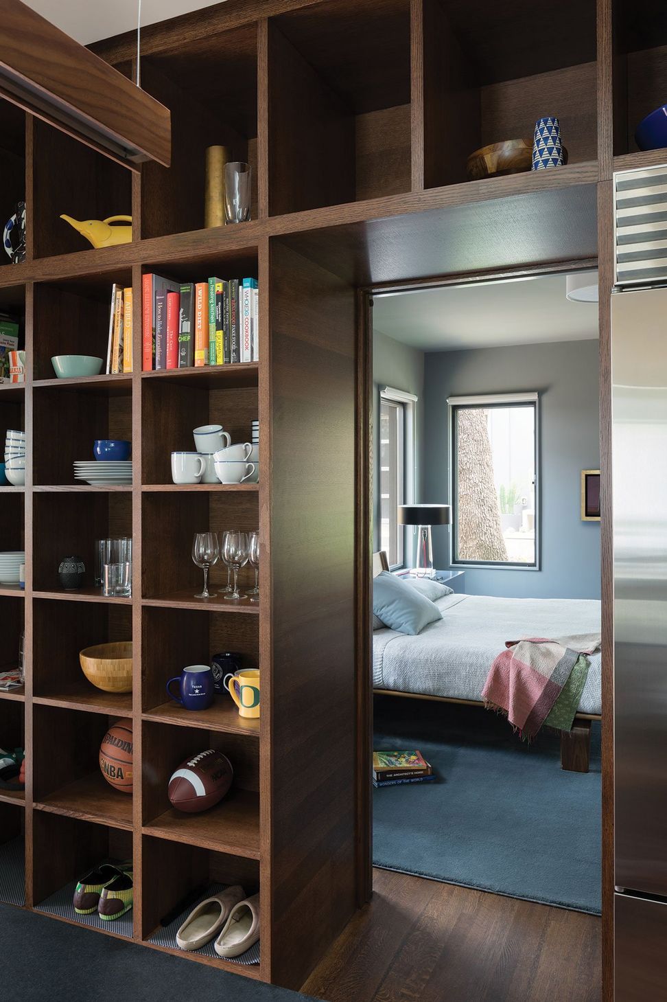 7LittleStacyParkCuppettKilpatrickArchitectureandInteriorDesignaustin-tx-bedroom-bookcase-portal-wood-finish.jpg