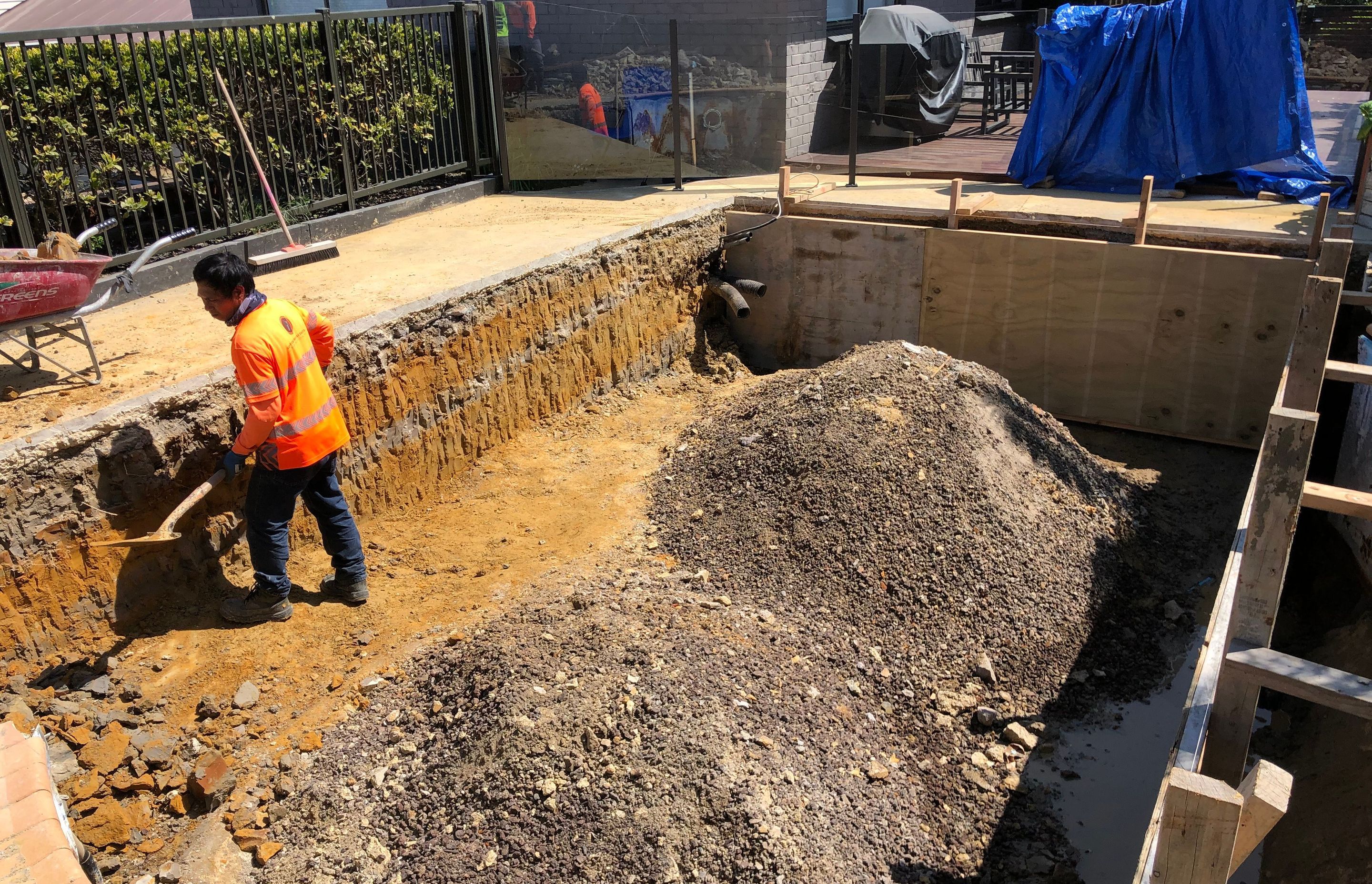 The existing pool liner &amp; walls were removed.  The pool was boxed &amp; formed and some hand digging required to create the new modern rectangular shape that was desired.