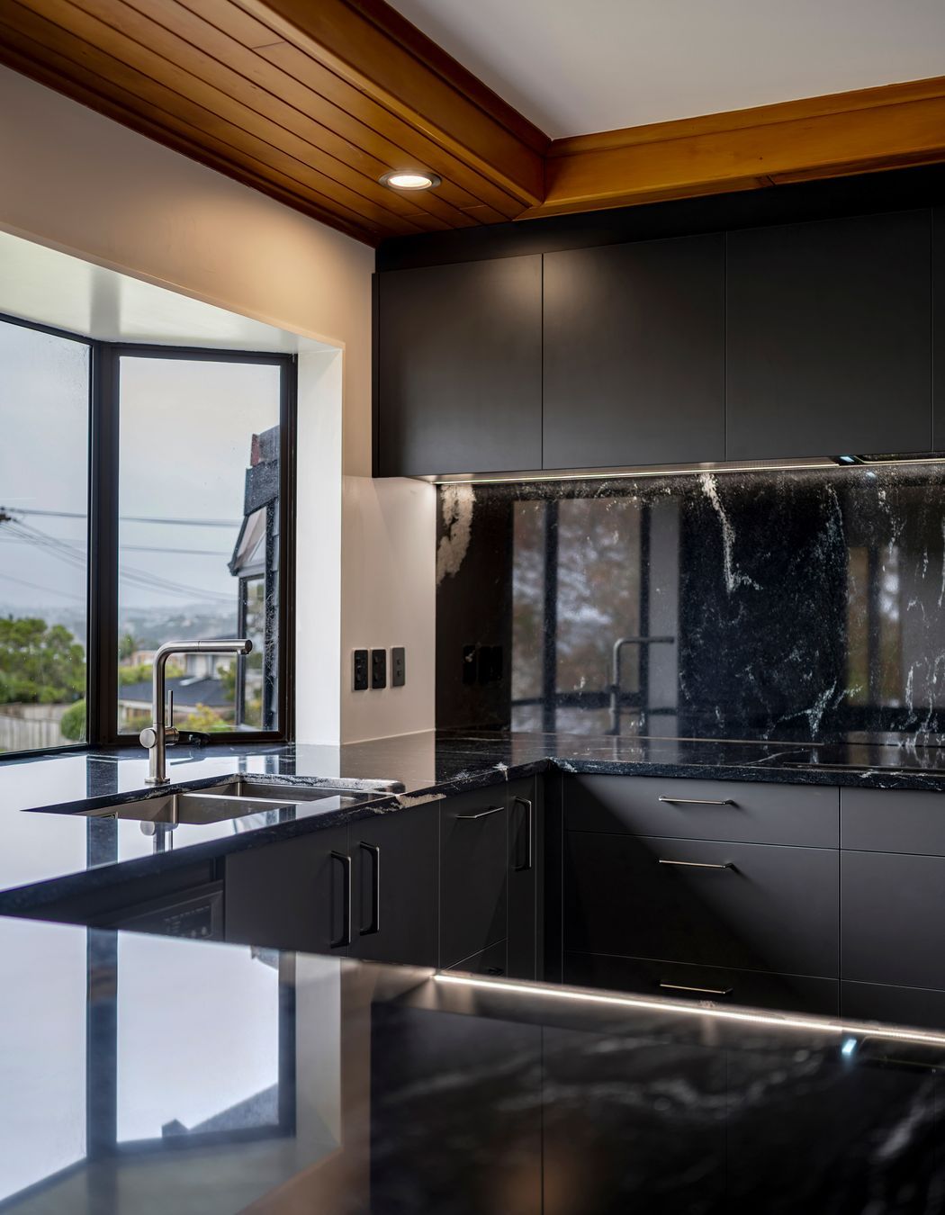 With waterfall edges and generous dimensions, this island anchors the space with quiet confidence.