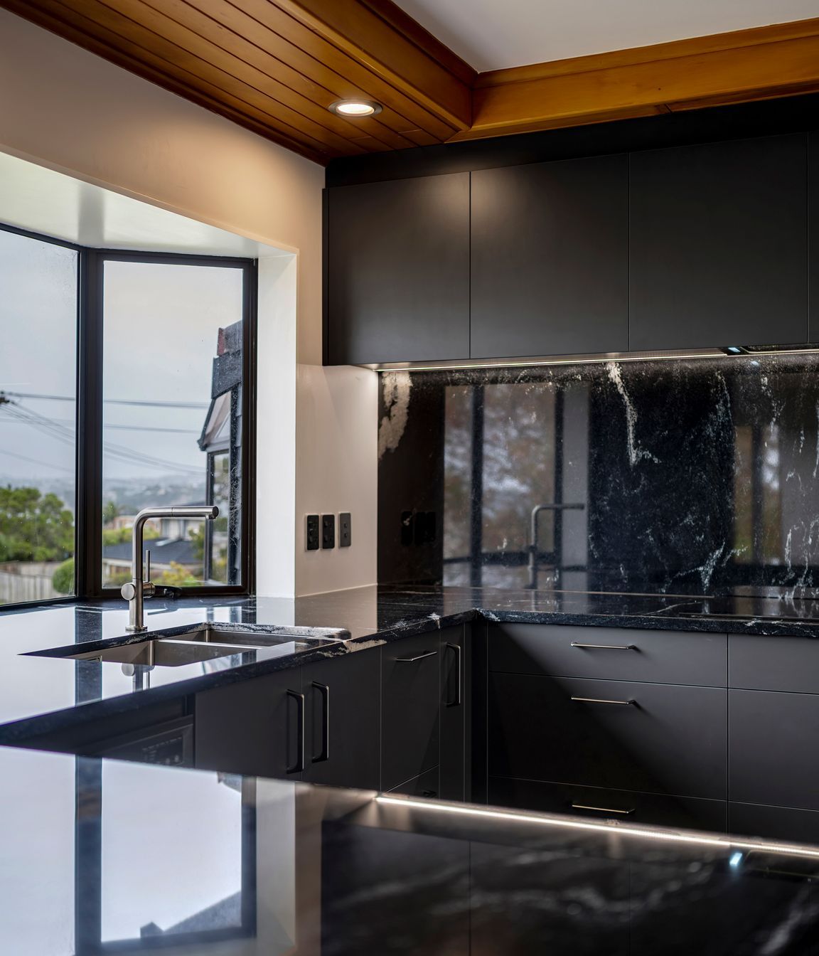 With waterfall edges and generous dimensions, this island anchors the space with quiet confidence.