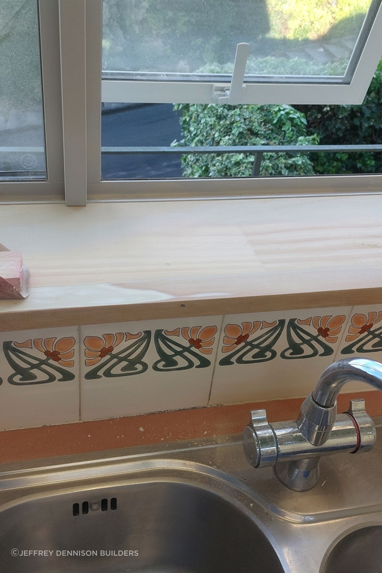 9-19-Tweed-St-Roslyn-Dunedin-Newly-installed-double-glazed-window-in-the-kitchen-being-sanded-to-ensure-a-perfect-finish-ready-for-painting-JDBuilders.jpg