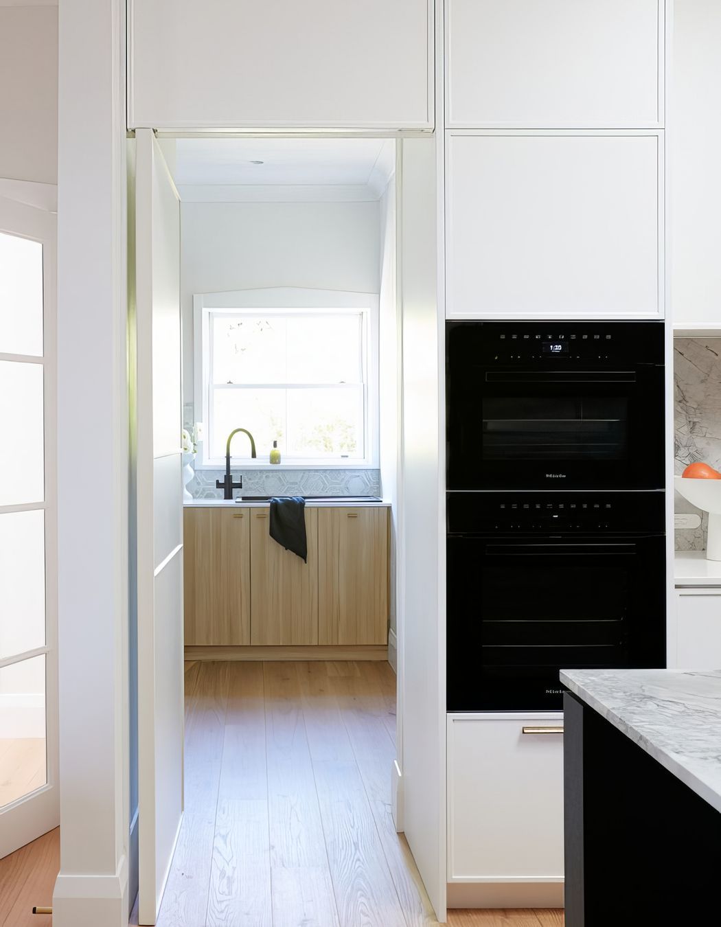 Open Hidden Door with Pivot Hinge to Butlers Pantry