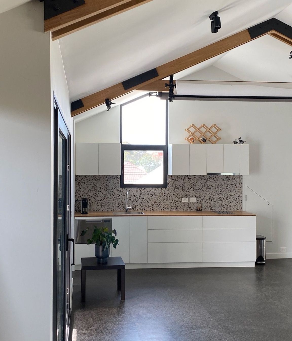 Kitchen with exposed timber trusses