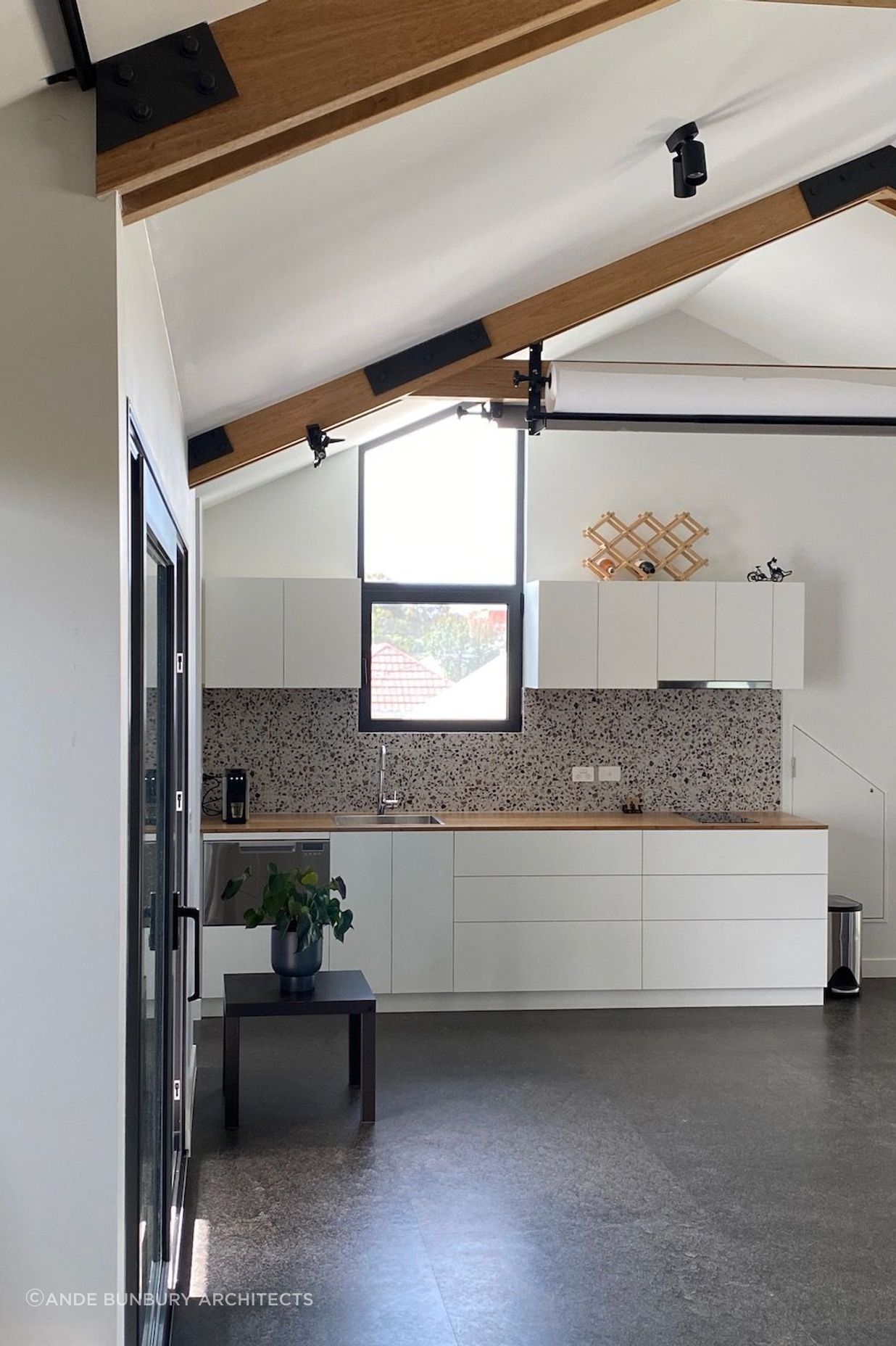 Kitchen with exposed timber trusses