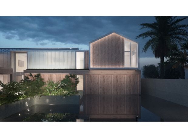 Night-time exterior architectural rendering of a contemporary multi-level residence. The home features a strong gabled central volume clad in vertical timber, expansive glazed openings, a flat-roofed adjoining wing, integrated warm lighting, and a reflective pool or water feature in the foreground. Tropical palm planting is visible around the property.