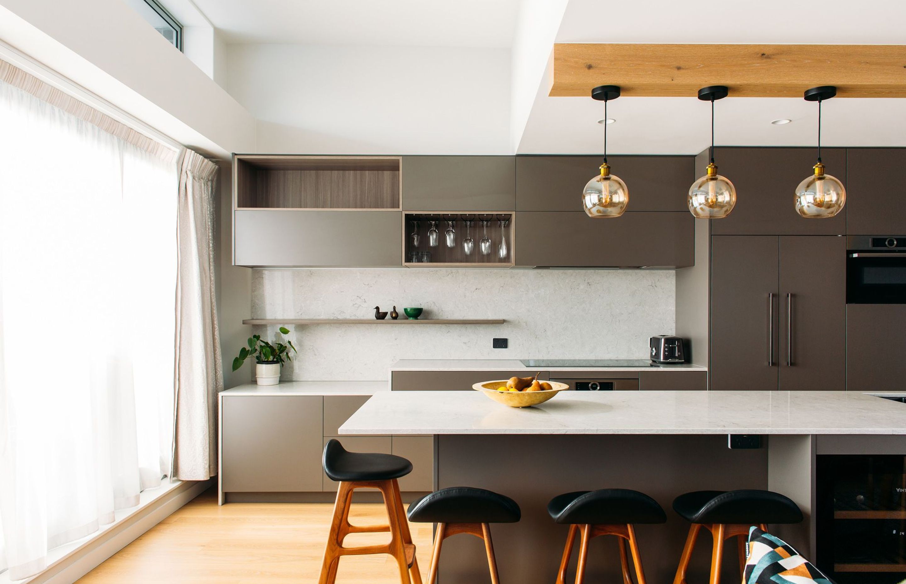 The kitchen benches double as workspaces when working from home.