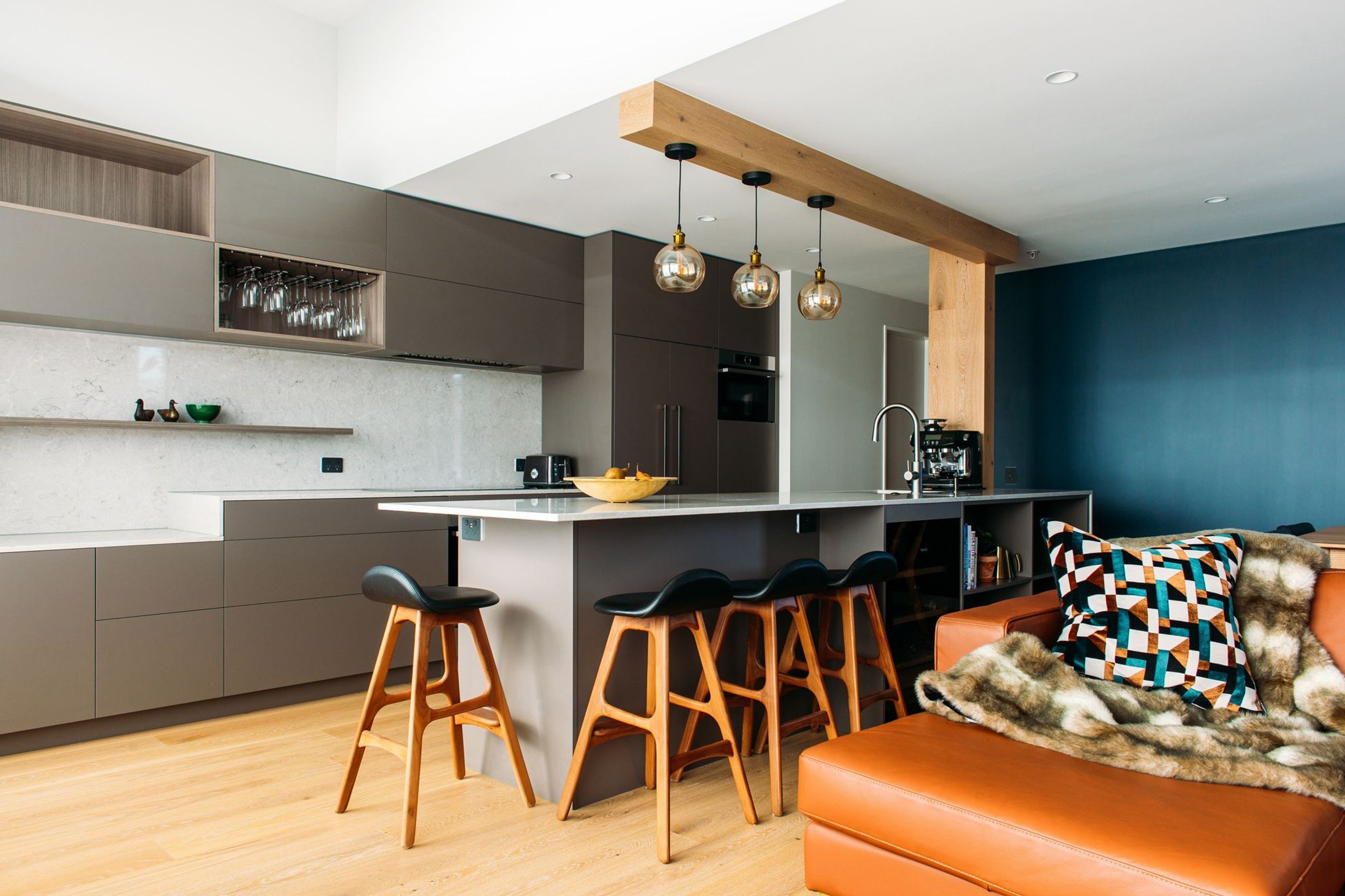 Resene Coast on the back wall reflects the harbour view, and compliments the Bo Concept sofa.