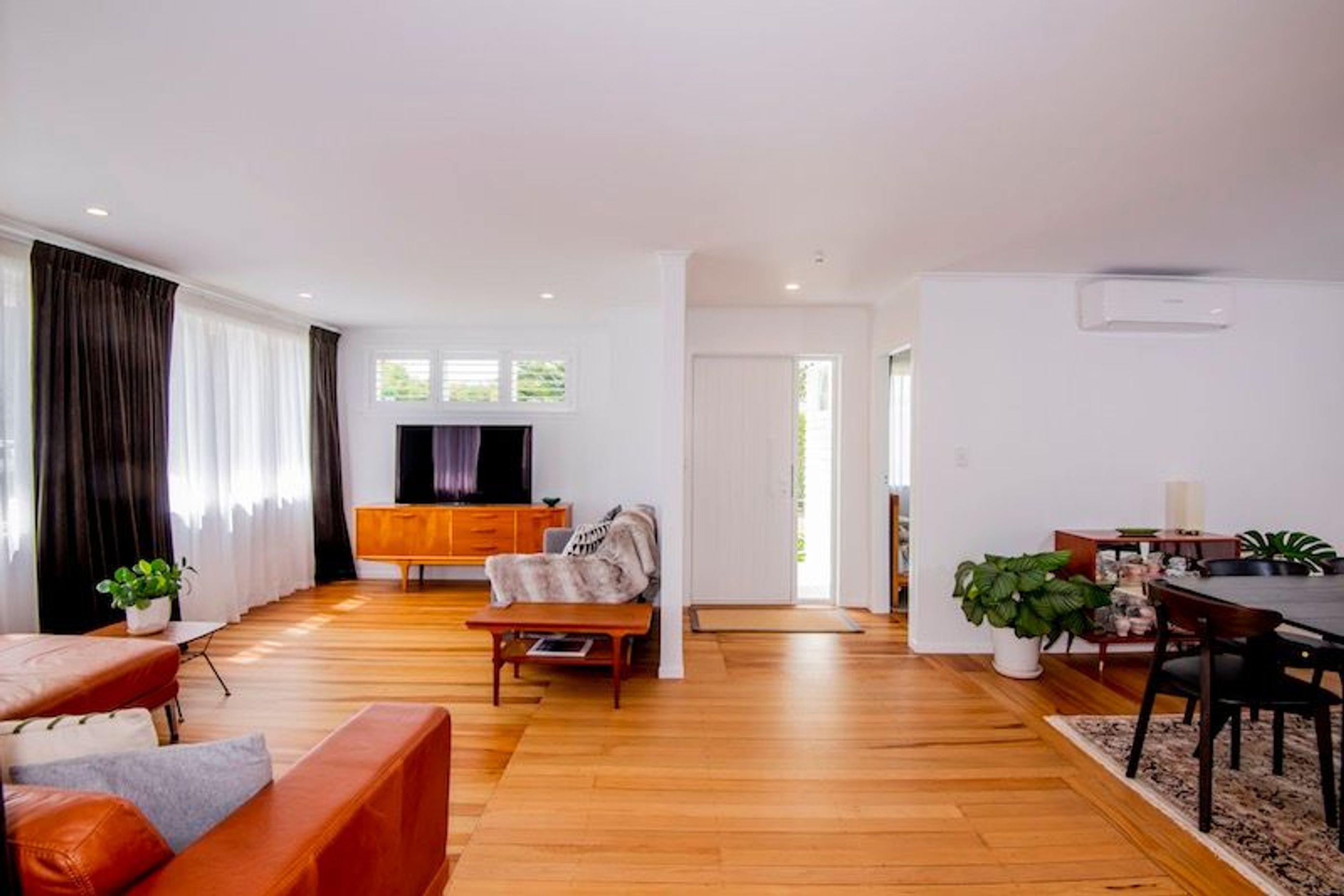 The original flooring was transformed, a hallway was removed for a wide open plan layout.