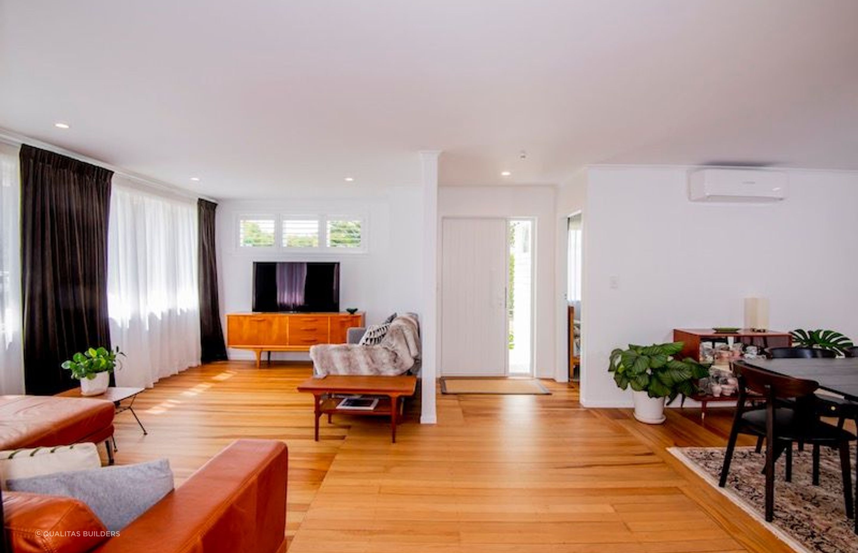 The original flooring was transformed, a hallway was removed for a wide open plan layout.