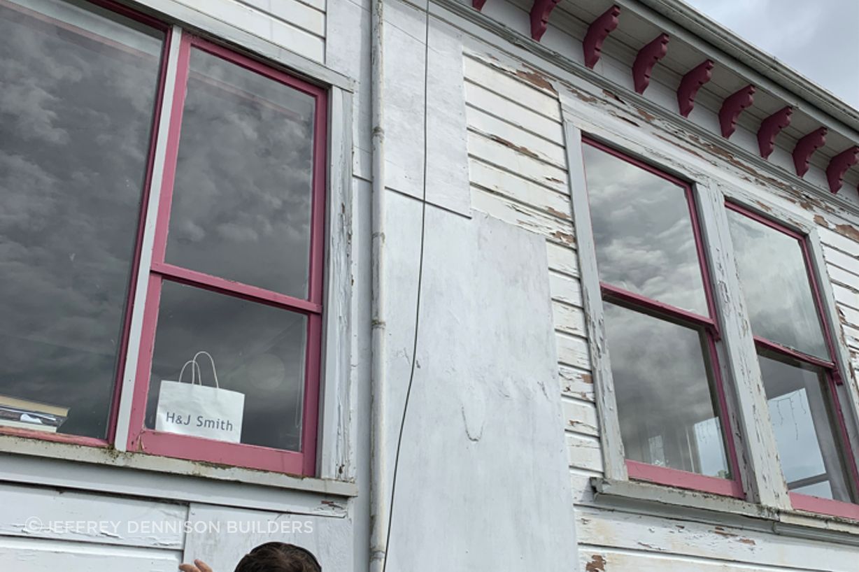B4-9-Fifield-St-Roslyn-Dunedin-Jeff-inspecting-damaged-windows-and-weatherboards-on-the-east-side-before-renovation-JDBuilders.jpg