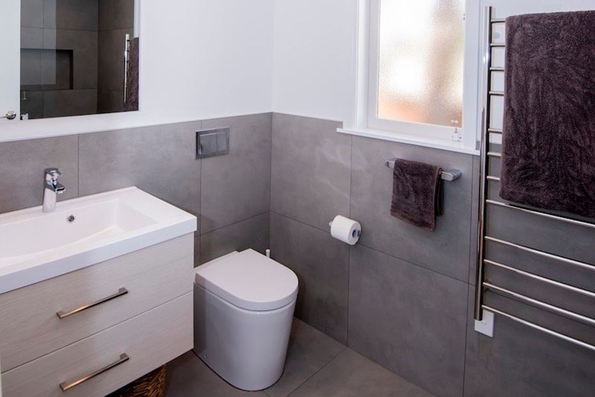 New tiling added a dramatic look to the bathroom upgrade.