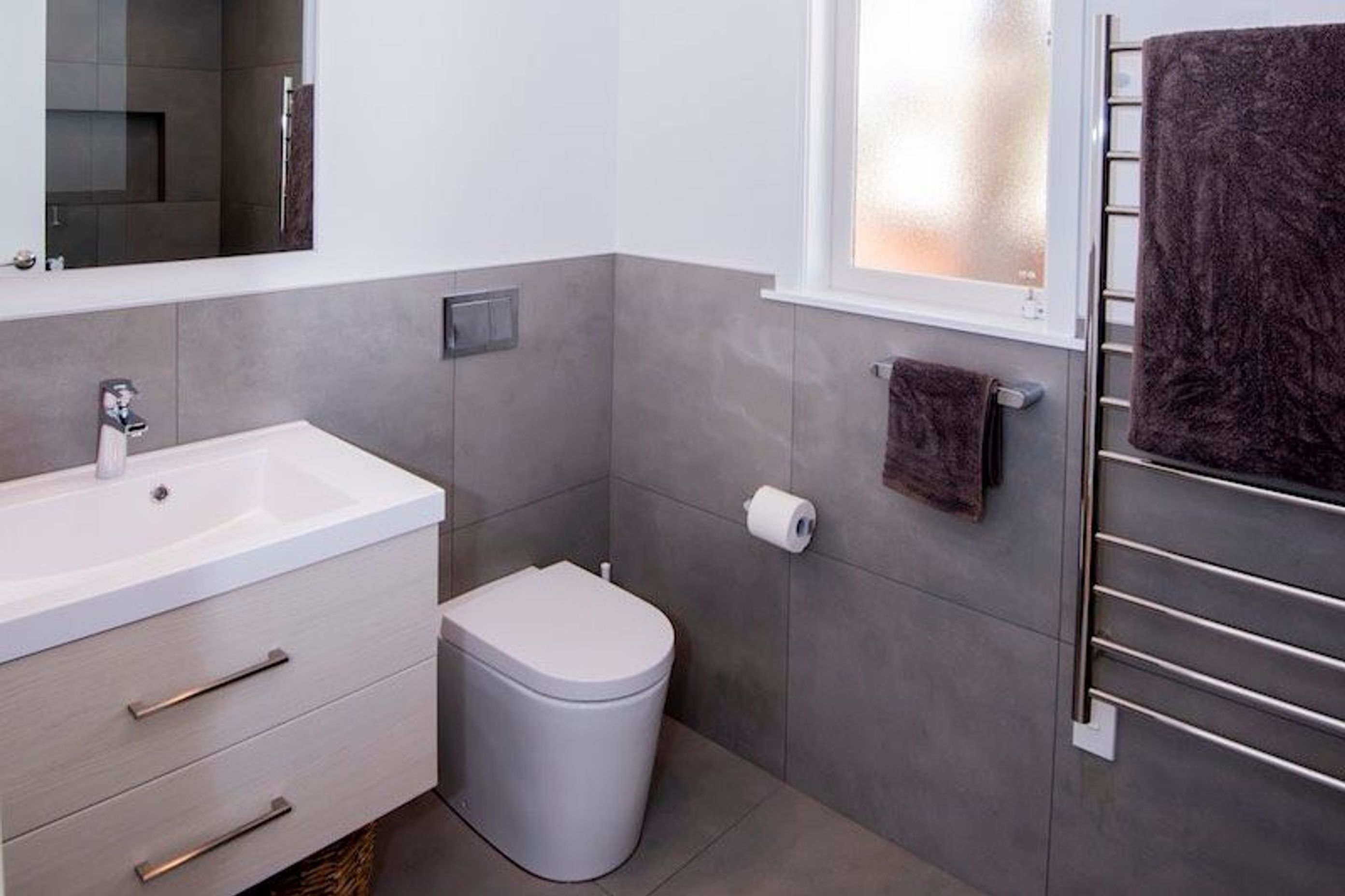New tiling added a dramatic look to the bathroom upgrade.