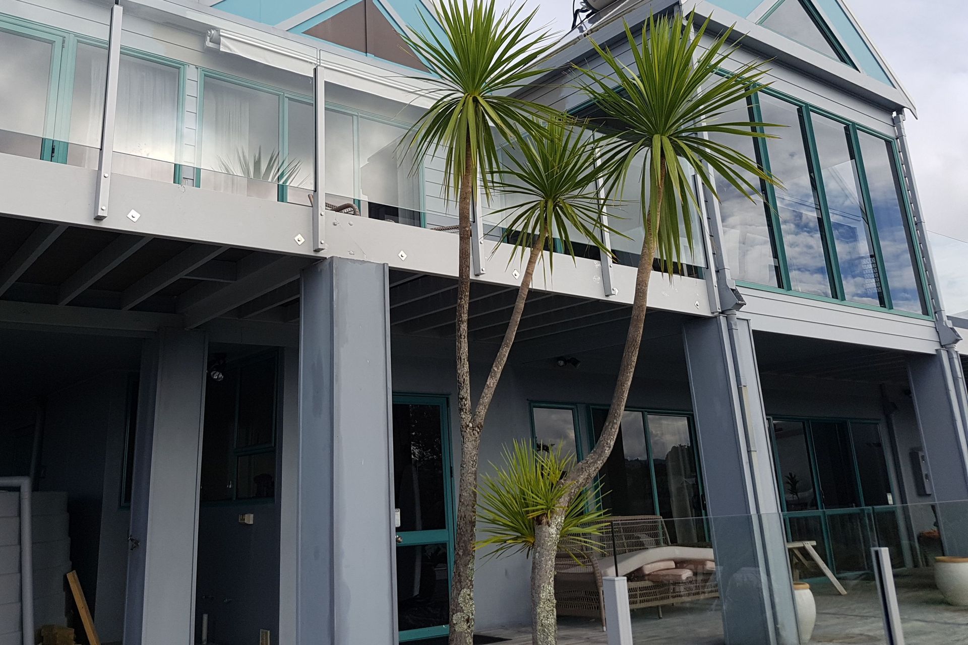 Before - showing original 80's joinery.  Original colour changed out in the replacement process, with picture window sizes increased.