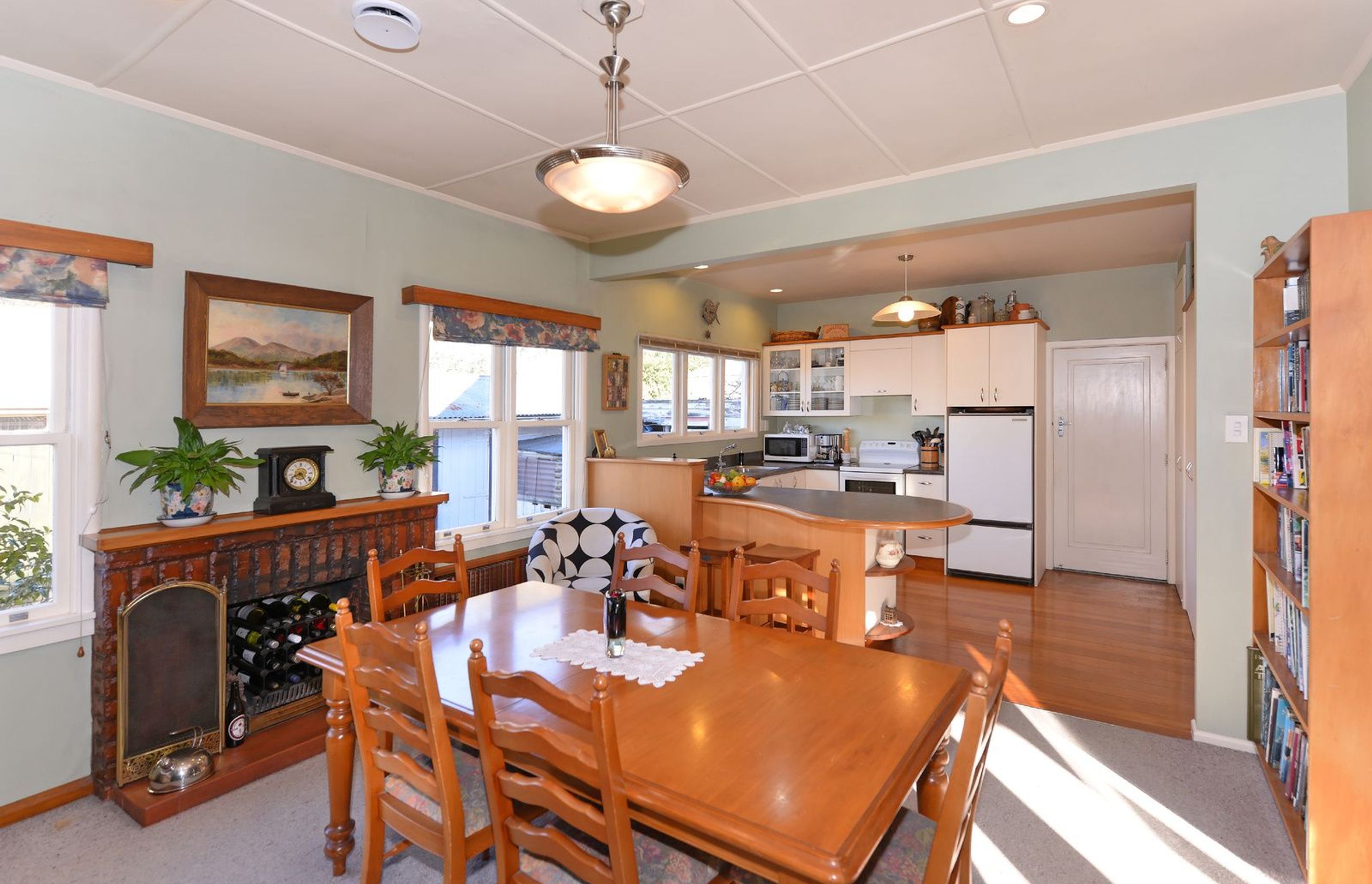 A beforehand photo showing the kitchen and dining room area