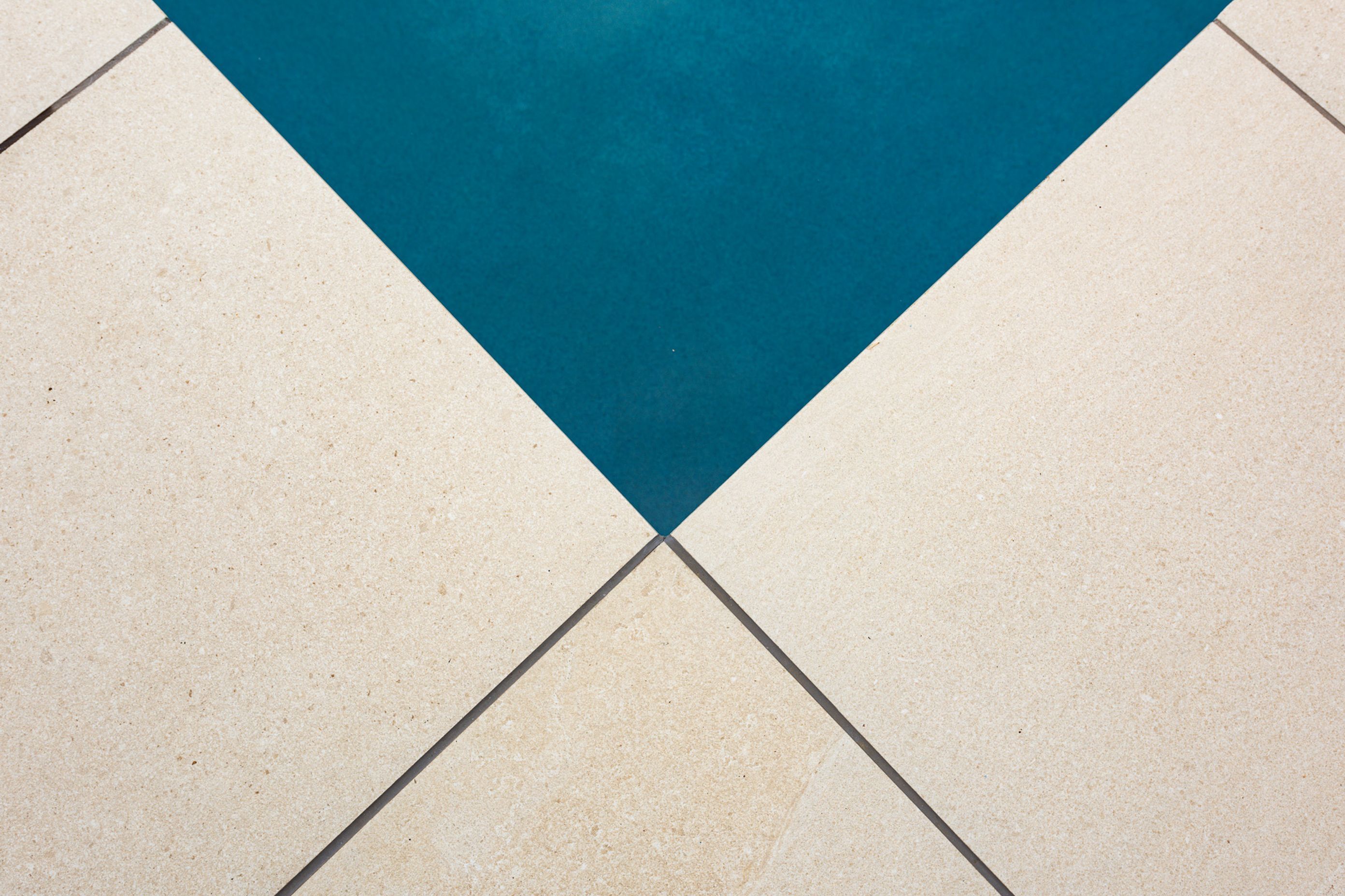 CMP Porcelain Coping and Pavers were installed to revitalise the immediate pool area.  The Pool was plastered with Jewels 4 Pools Ultra in a custom blended shade
