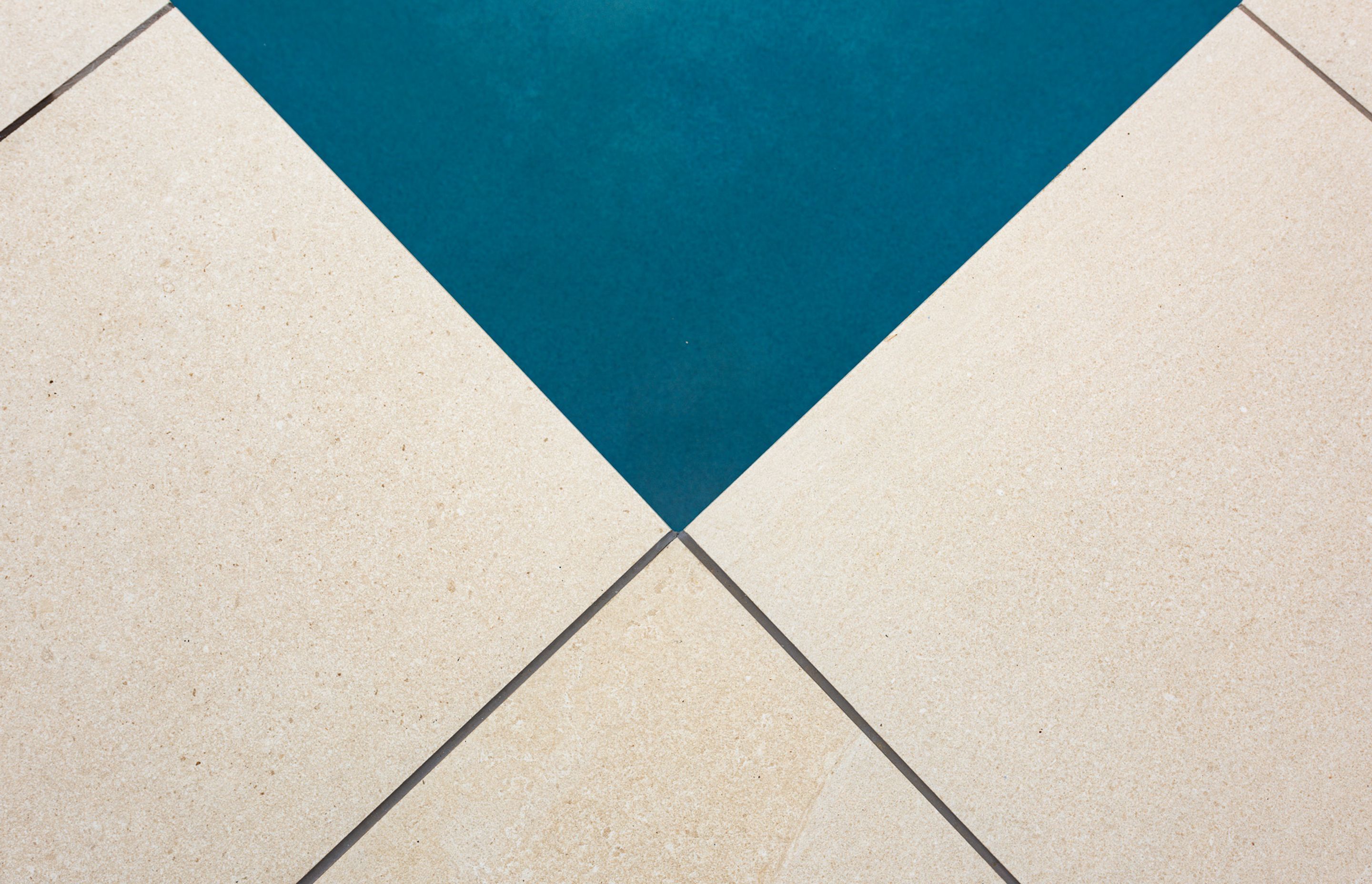 CMP Porcelain Coping and Pavers were installed to revitalise the immediate pool area. The Pool was plastered with Jewels 4 Pools Ultra in a custom blended shade