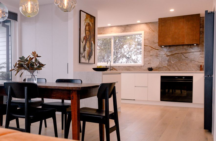 Renovated Kitchen with Coastal Views and Refined Material Palette