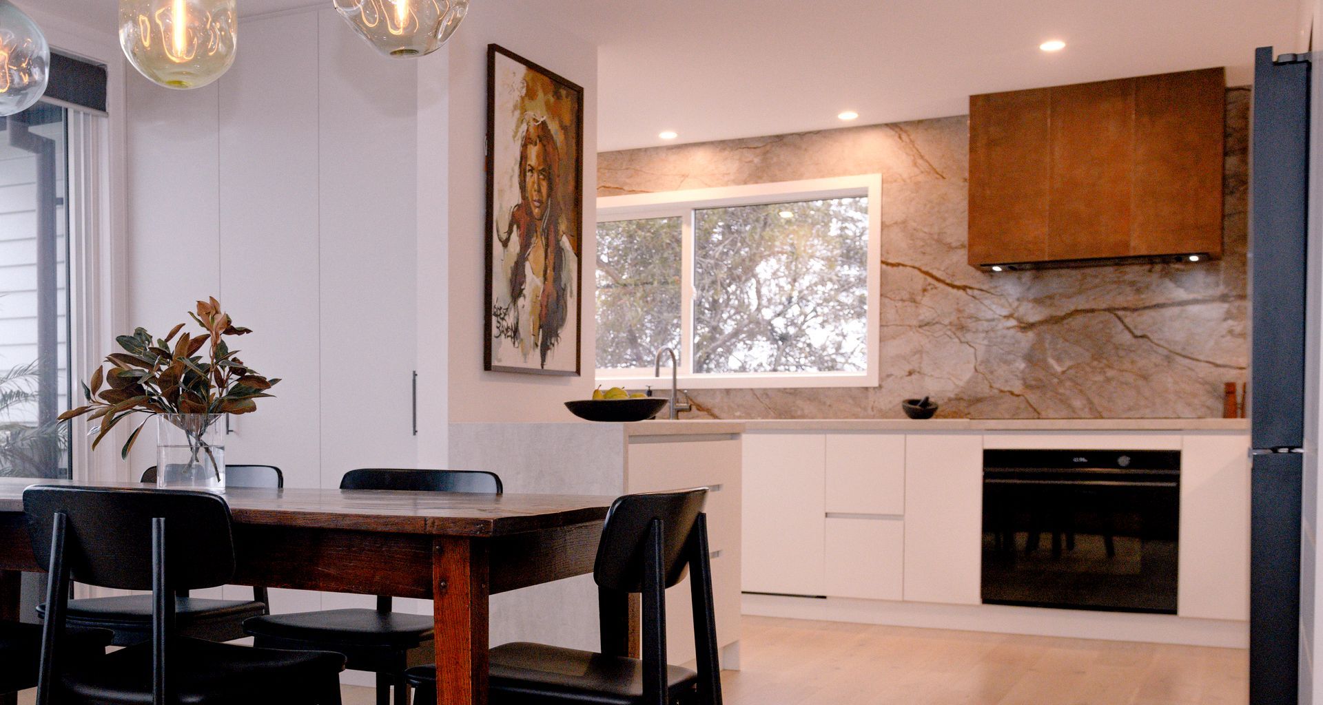 Renovated Kitchen with Coastal Views and Refined Material Palette banner