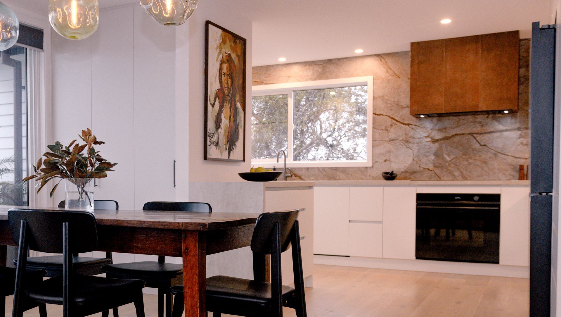 Renovated Kitchen with Coastal Views and Refined Material Palette banner