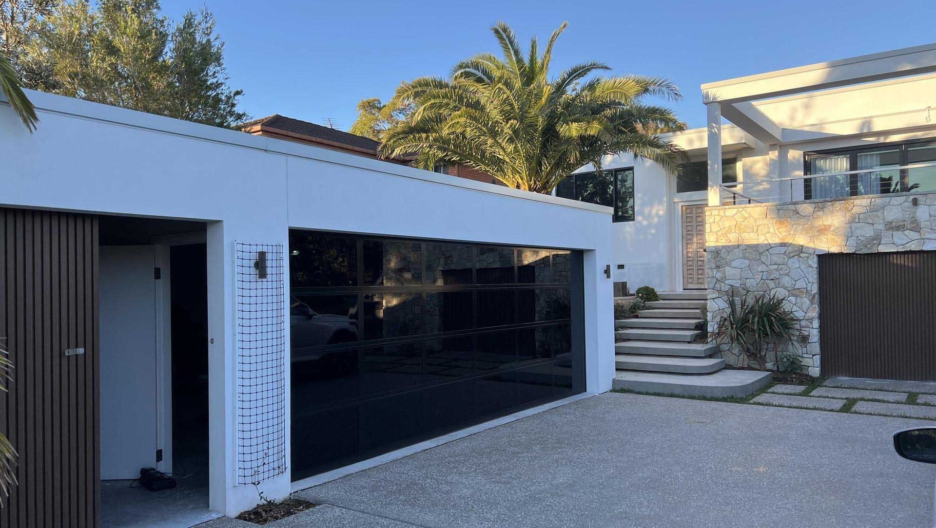 Custom Designed Garage Door - Central Cosat banner