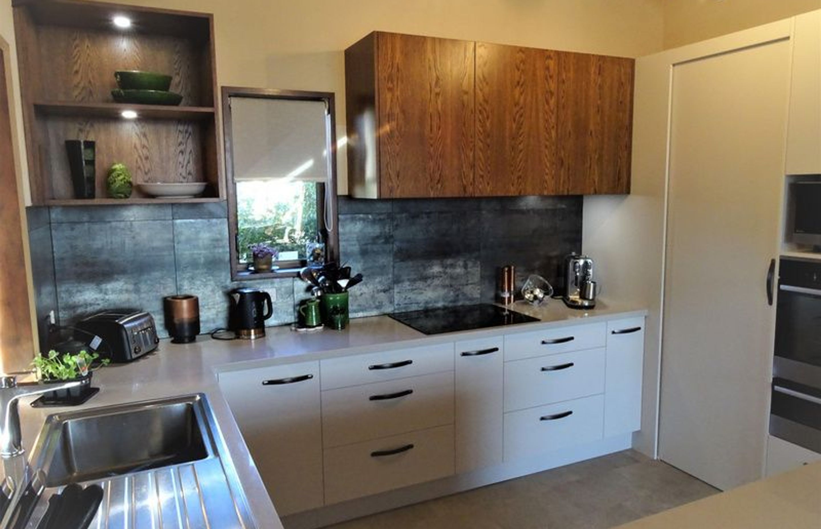Different style drawers adding interest and storage to this kitchen design in Dunedin