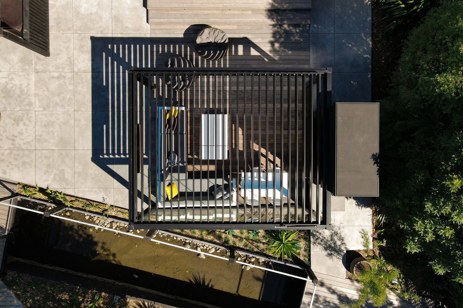 Overhead view of the open louvres, on the freestanding louvre roof.