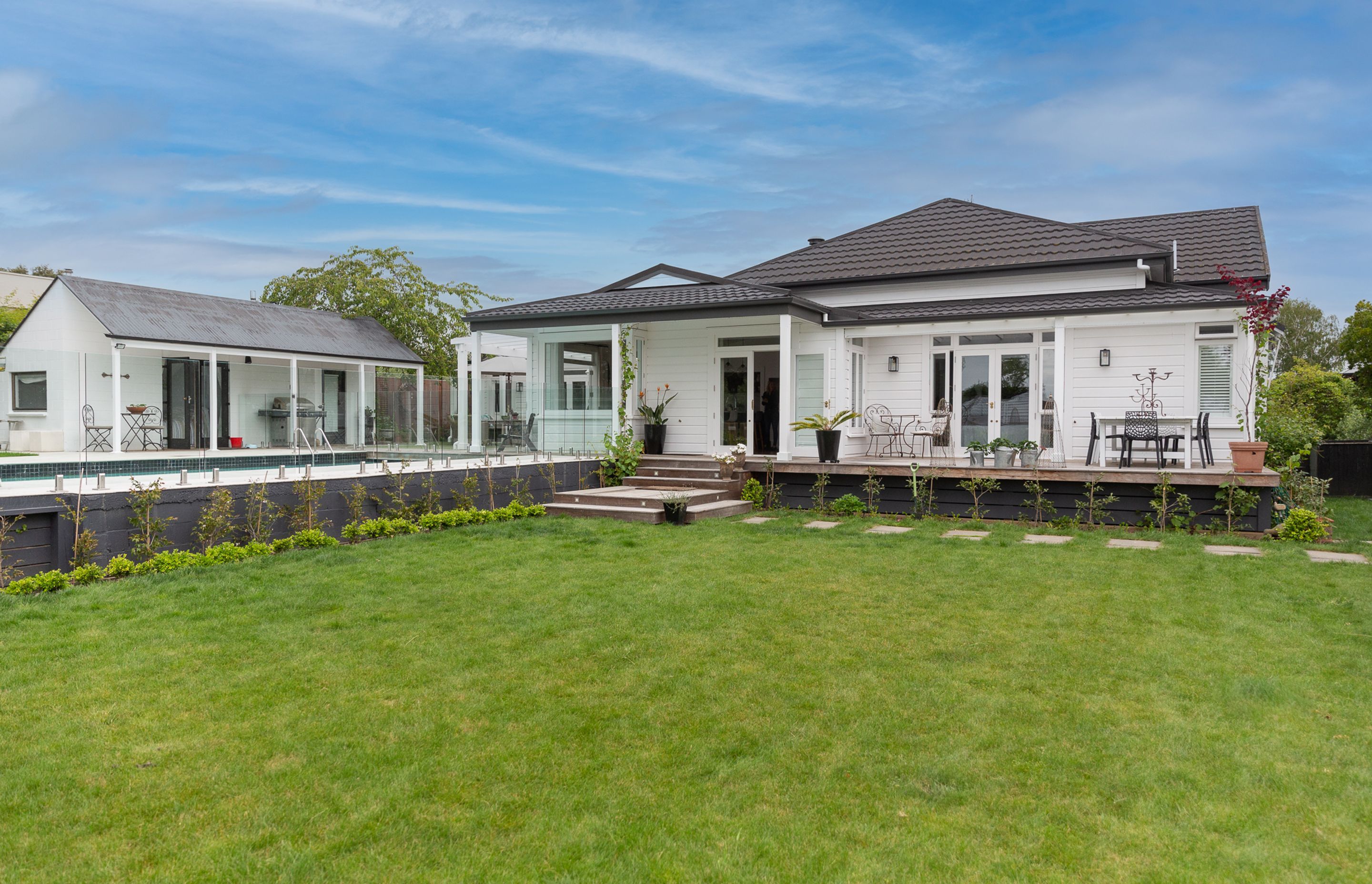 The exterior doors on this project look peacefully down on the gardens allowing access from all areas of the home