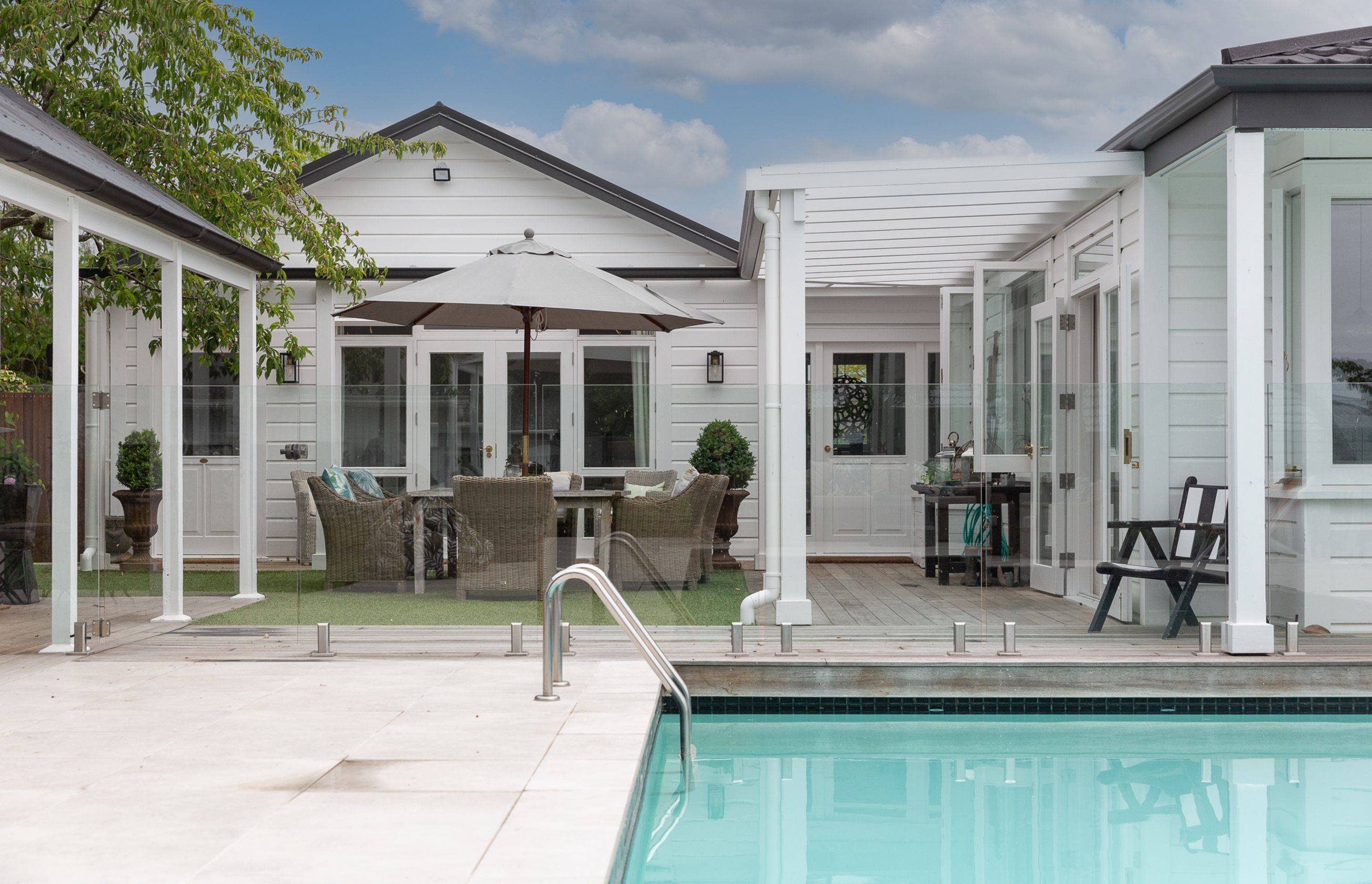 Bi folding kitchen windows allow easy access to the kitchen for a cool drink or platter of nibbles.