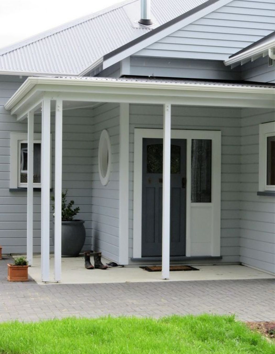 Entrance to the home showing the wooden window framing