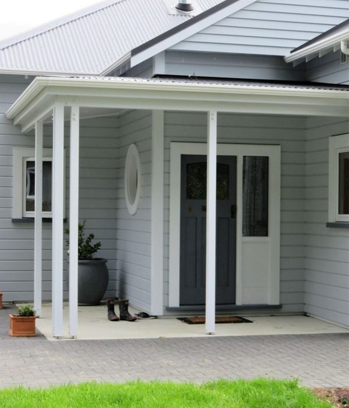 Entrance to the home showing the wooden window framing