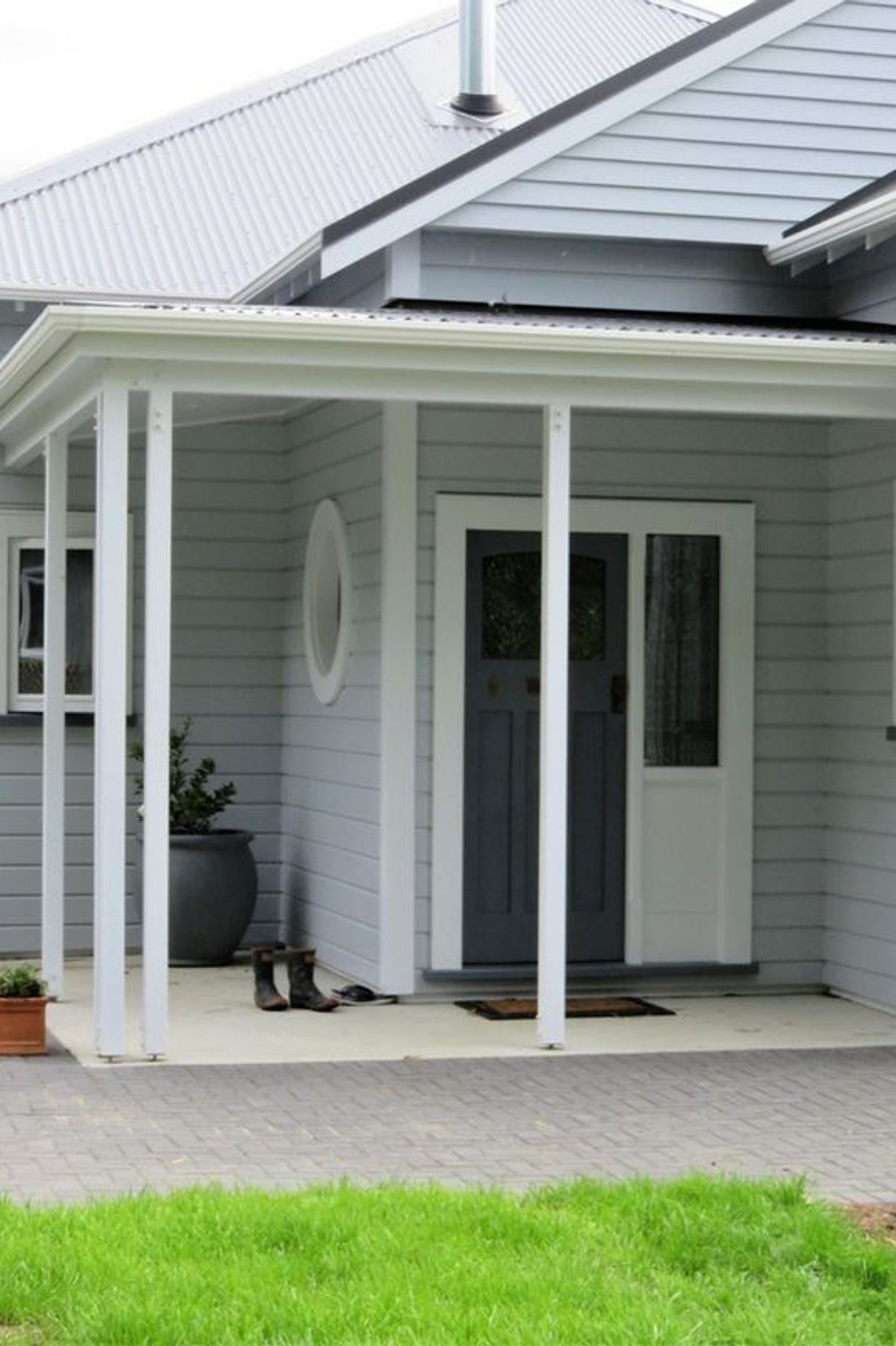 Entrance to the home showing the wooden window framing