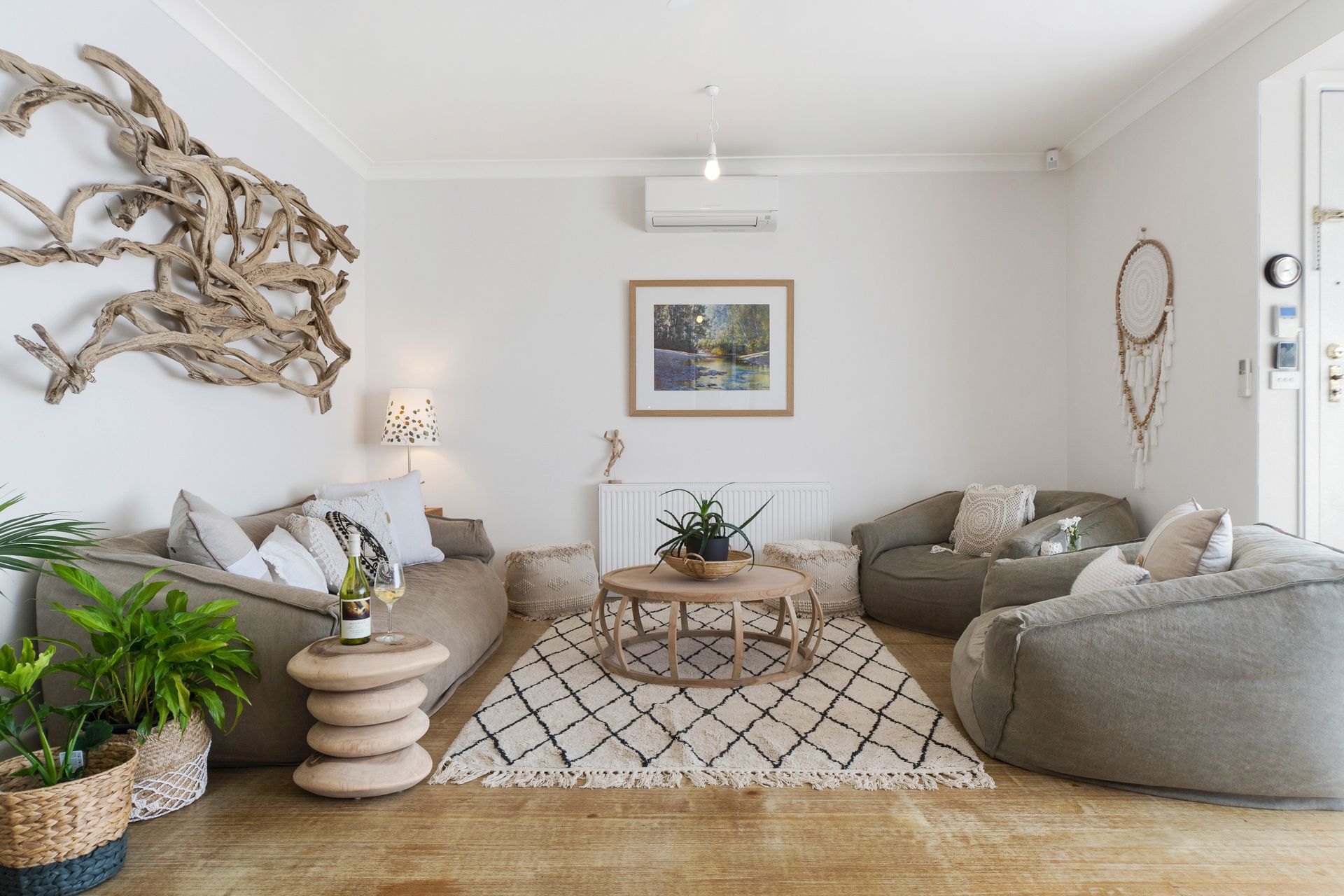 Minimalist coastal decor fit right at home in the front living room of Fishermans' Cottage