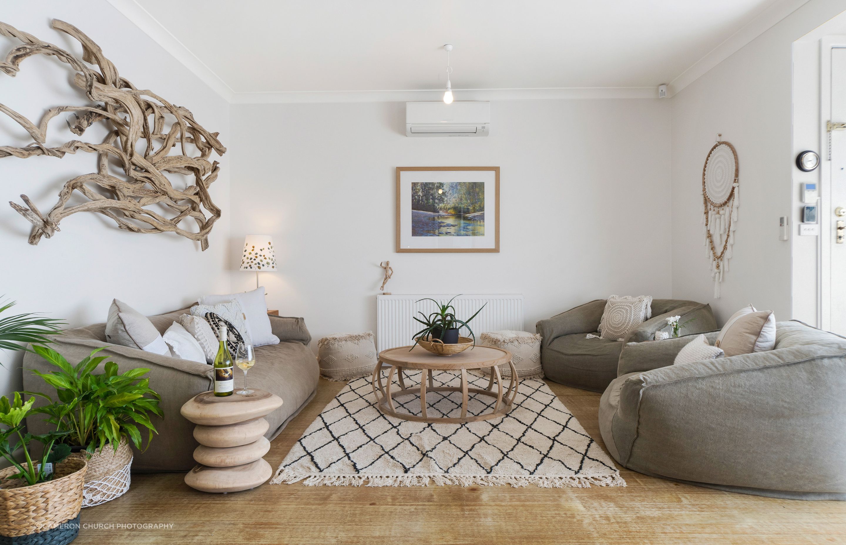 Minimalist coastal decor fit right at home in the front living room of Fishermans' Cottage
