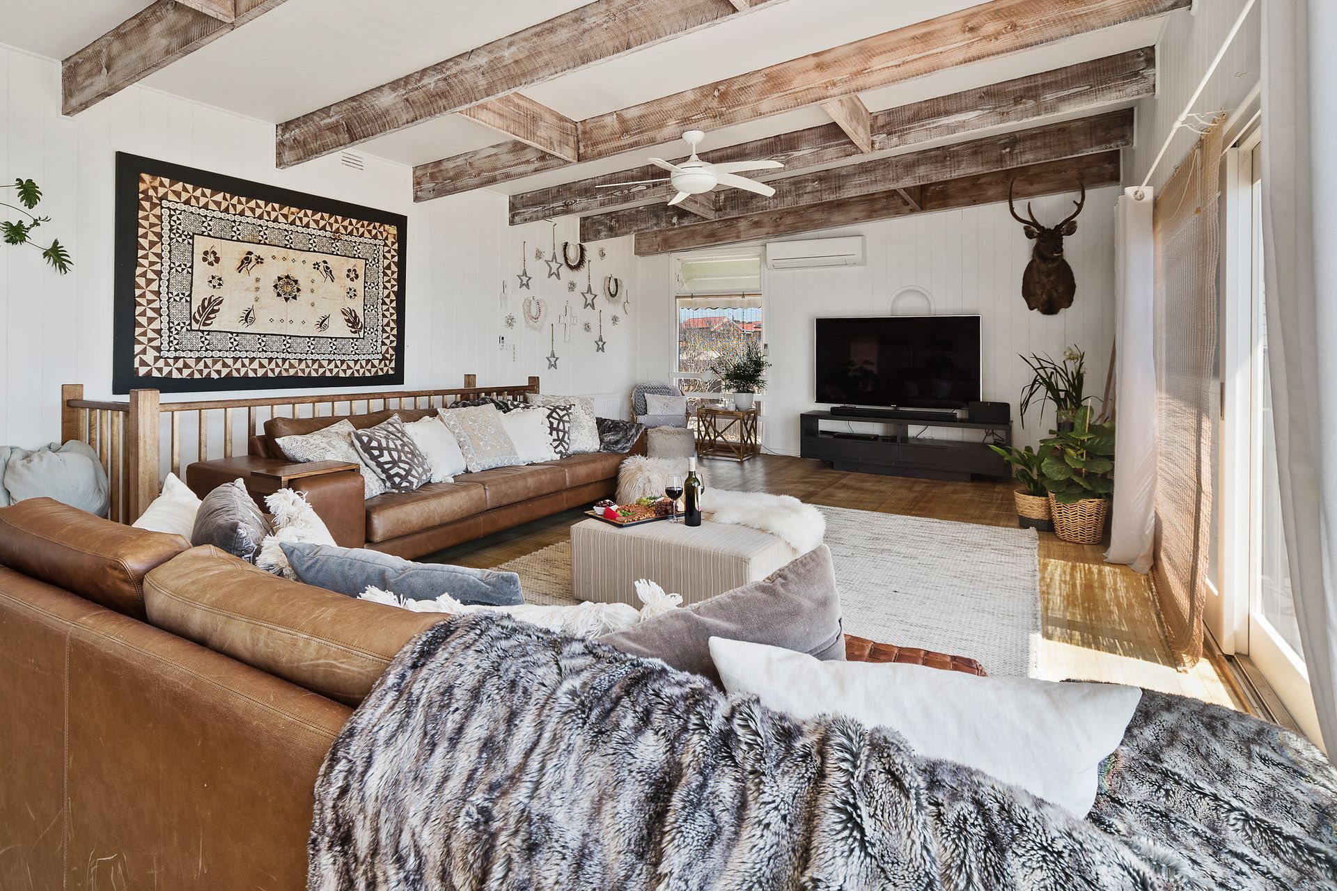 Find seaside serenity in this upstairs living space, joining directly onto the deck with oceanfront views