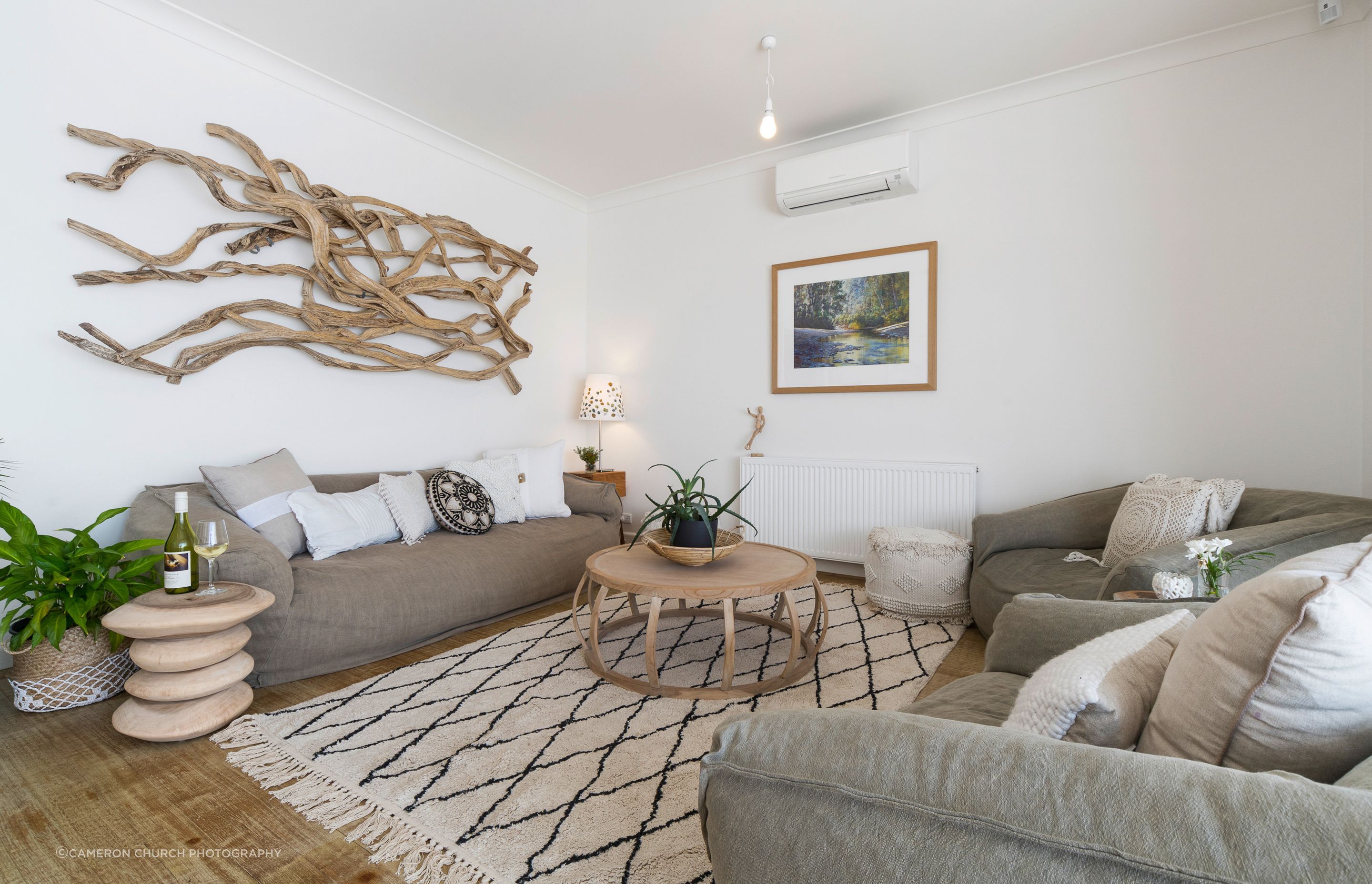 Driftwood details meet coastal coziness in this front living space