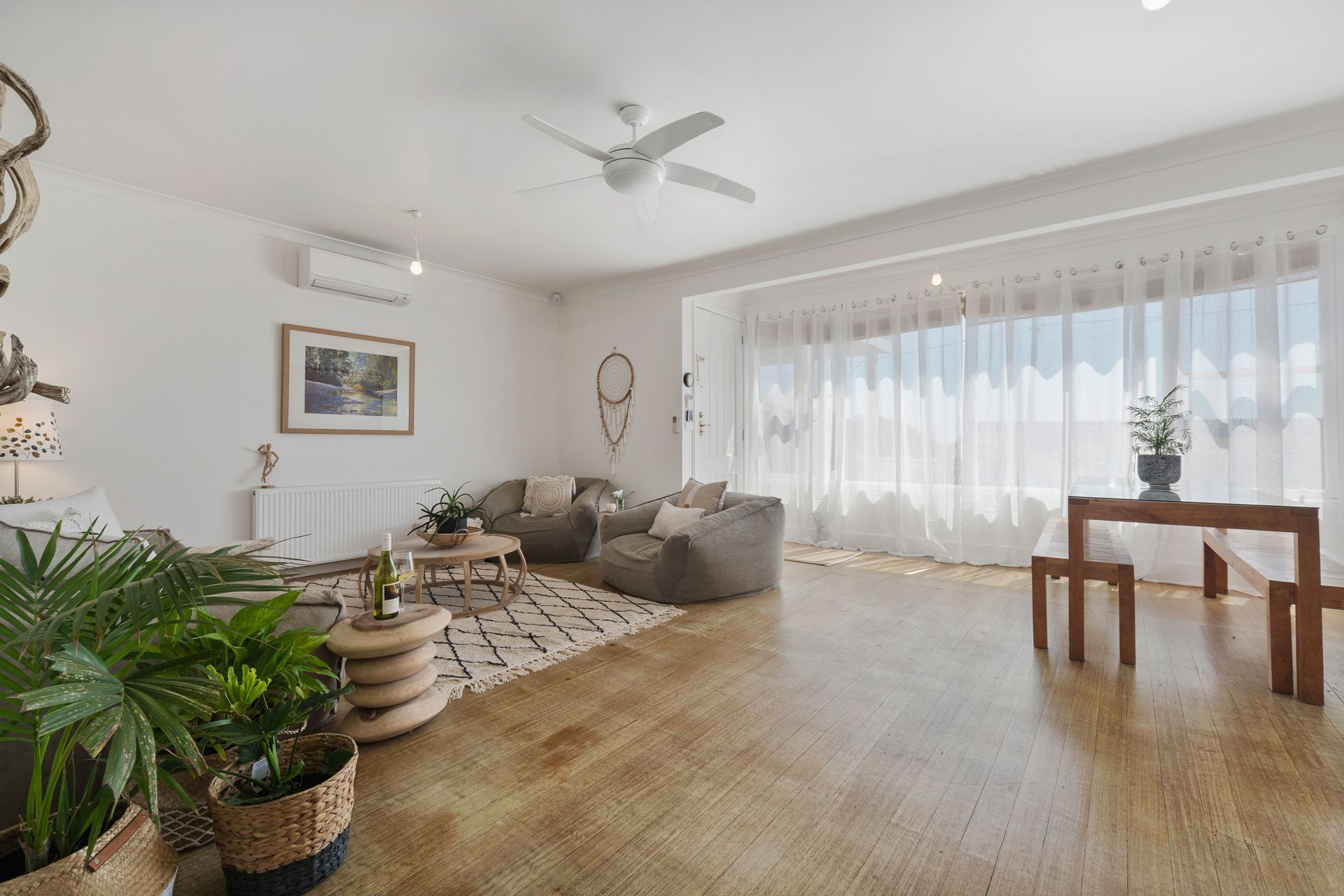 A simple entrance to a charmed 1059's beachside cottage, understated yet homely