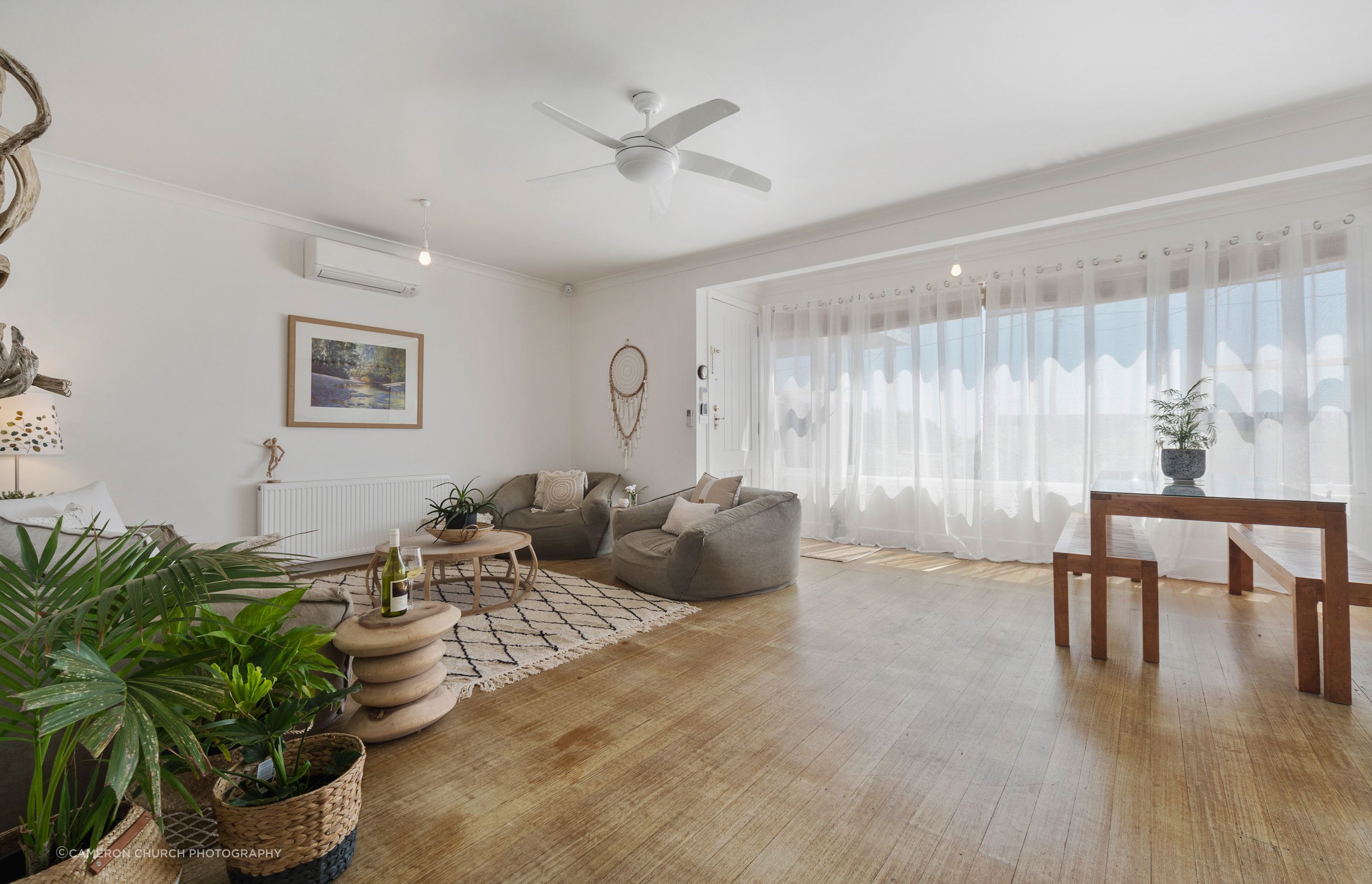 A simple entrance to a charmed 1059's beachside cottage, understated yet homely