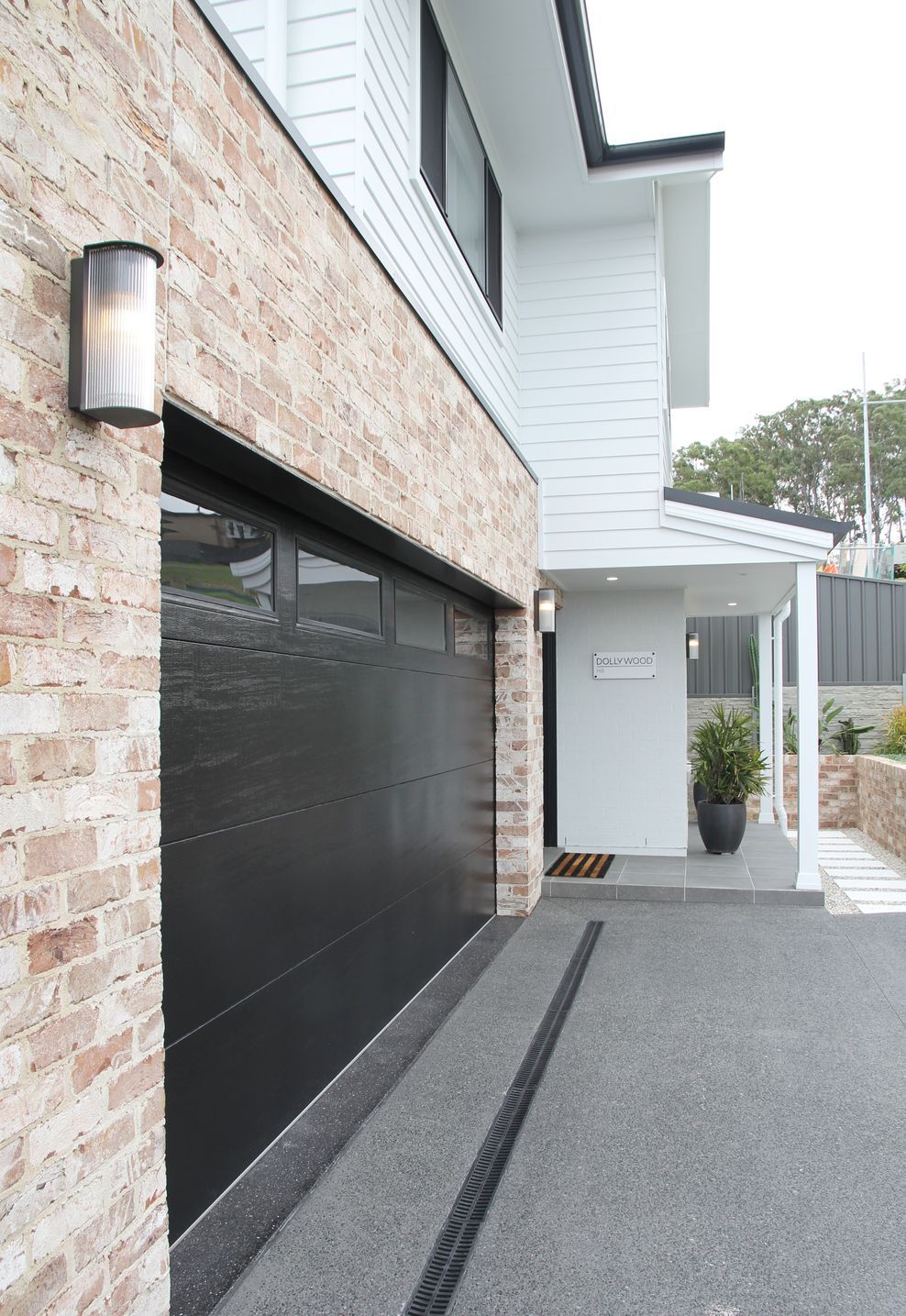 Evolution-Building-Group-Garage-Door-Side-View-Dolly-Circ-Calderwood-Flatline-with-Plain-Ranch-Windows-in-Night-Sky-ap-compressed.jpg