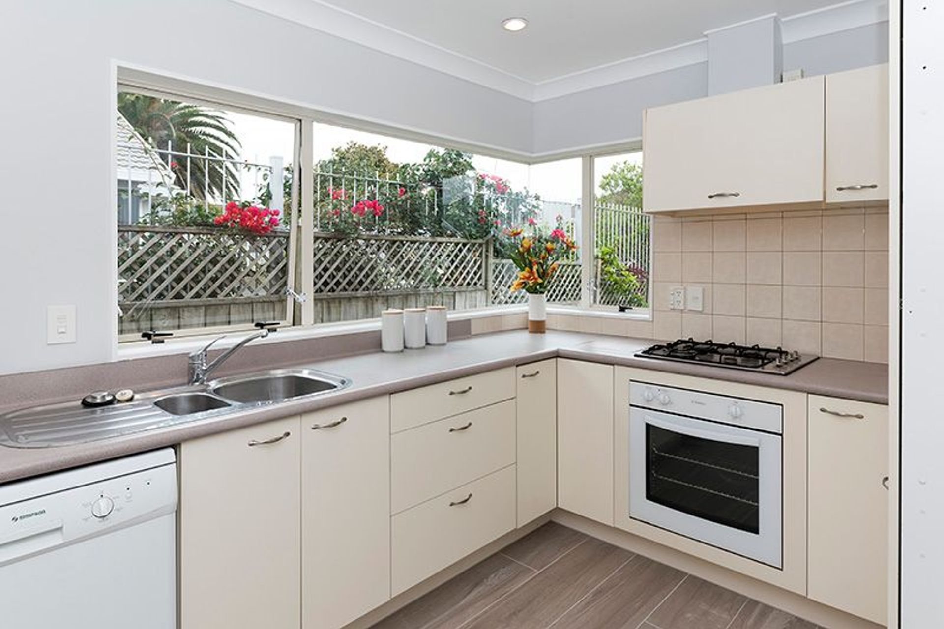 Kitchen - Still in remarckable condition, we modernised this area while retaining the origoinal cabinetry and bench top