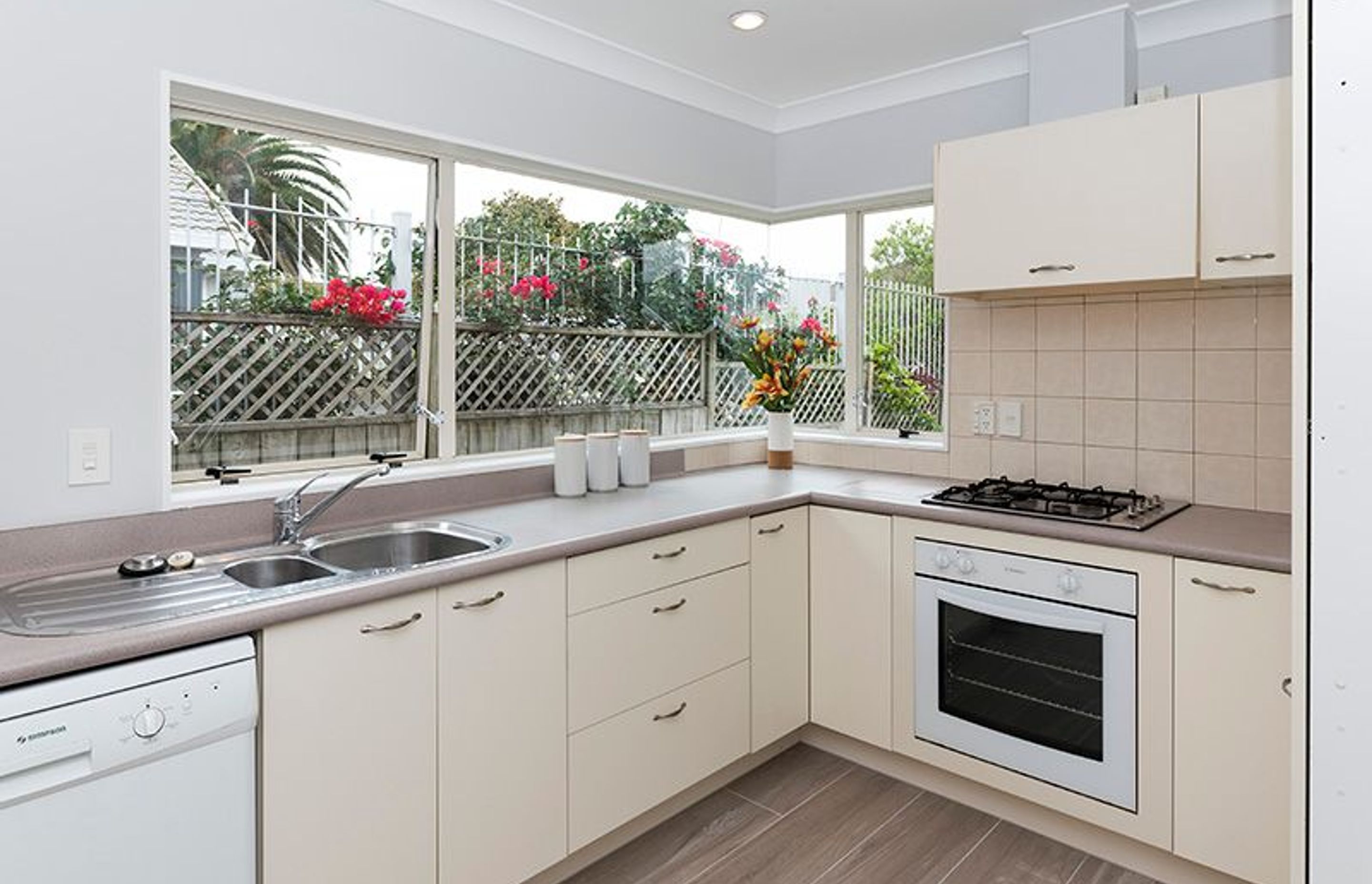 Kitchen - Still in remarckable condition, we modernised this area while retaining the origoinal cabinetry and bench top 