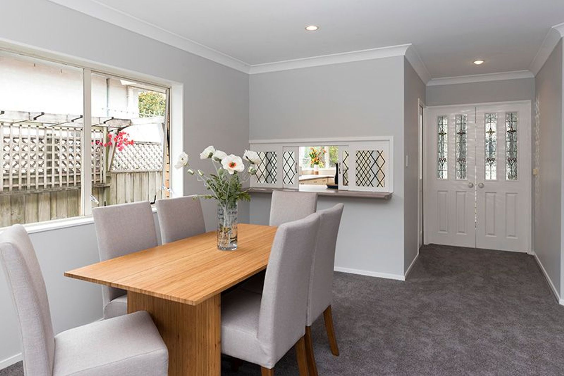 Dining - This area can be shut off from the front door area with these original stained glass doors