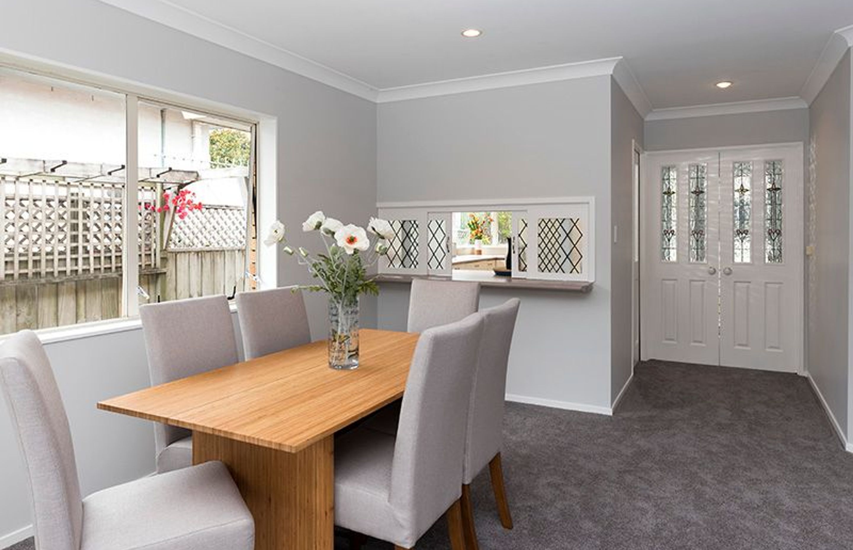 Dining - This area can be shut off from the front door area with these original stained glass doors