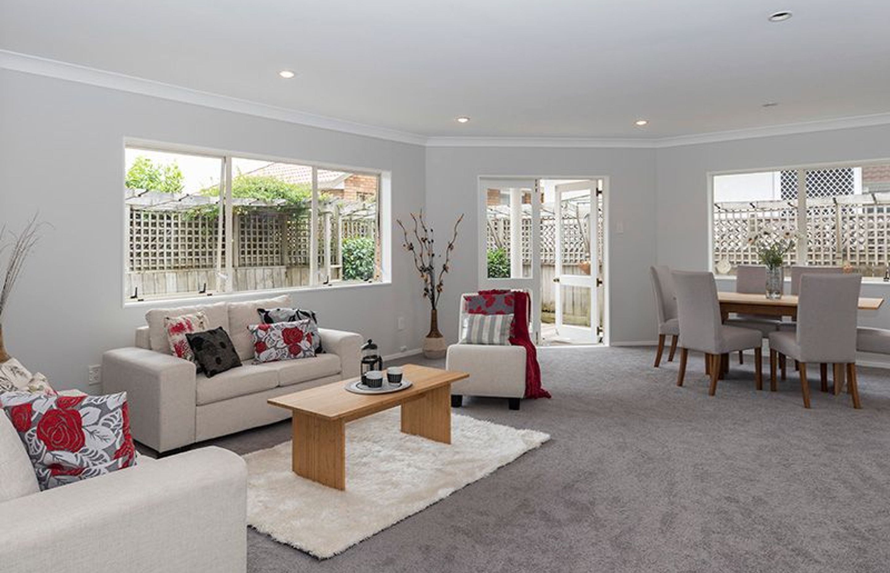 Living Room - Pink carpet and peeling pink wallpaper to this beautiful modern suntrap.