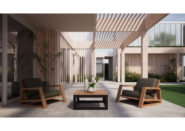 A contemporary covered outdoor courtyard lounge with timber slatted pergolas, exposed timber ceilings and posts, concrete paving, and large glazed openings. Two timber-framed lounge chairs surround a low coffee table, with planting and a small lawn visible within the courtyard.